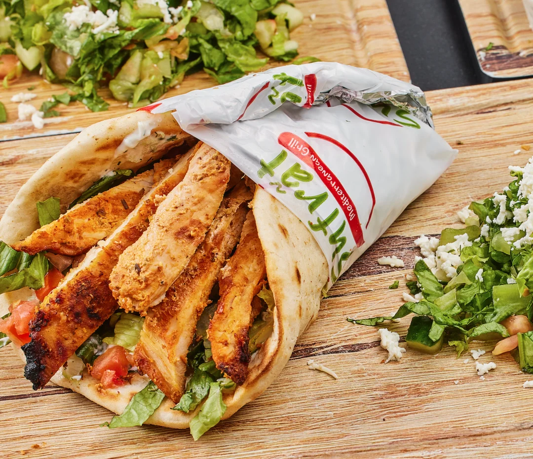 Gyro Chicken Sandwich- Sliced grilled chicken breast with lettuce, chopped tomatoes, onions tzatziki sauce.