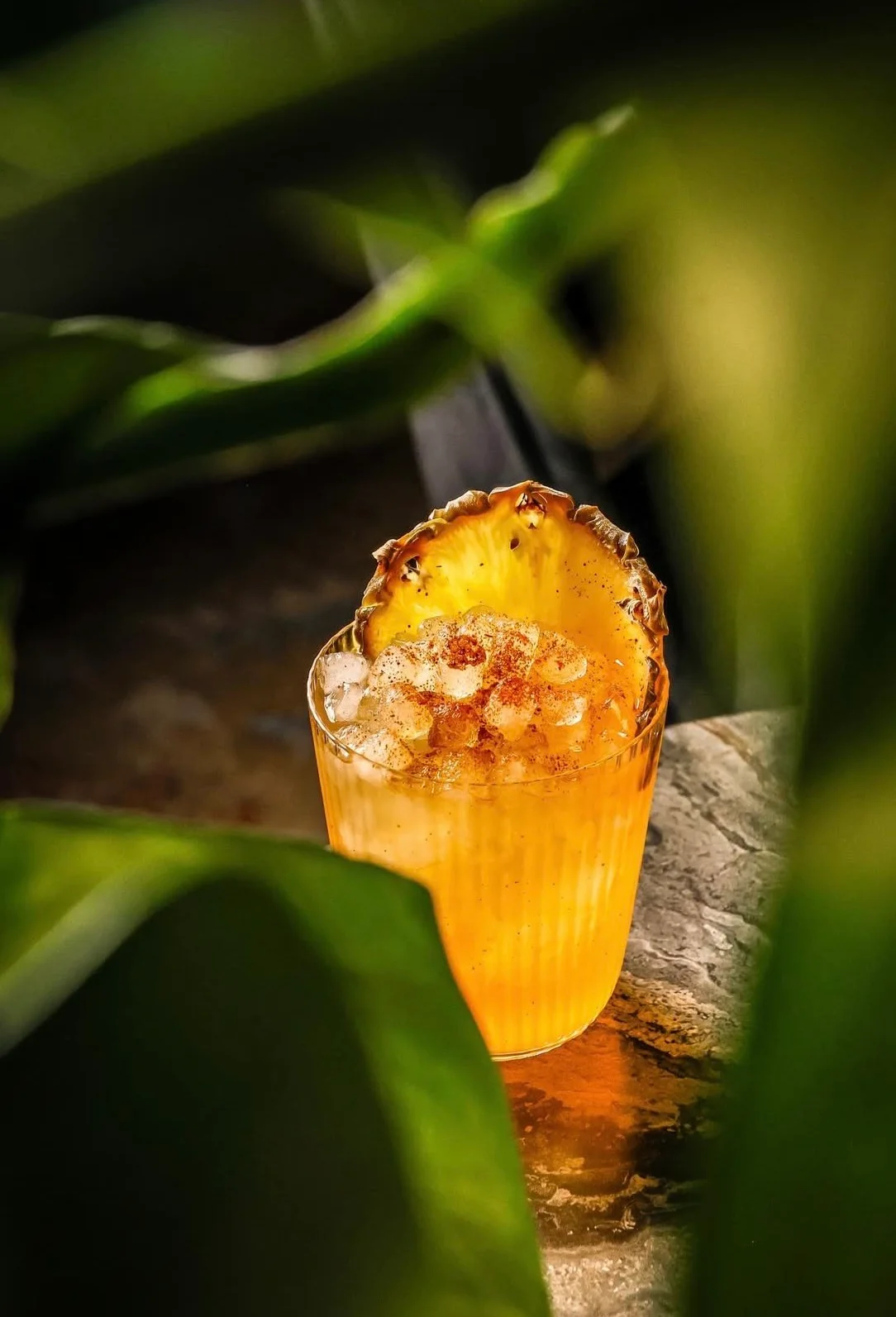 Refreshing tropical cocktail with pineapple garnish