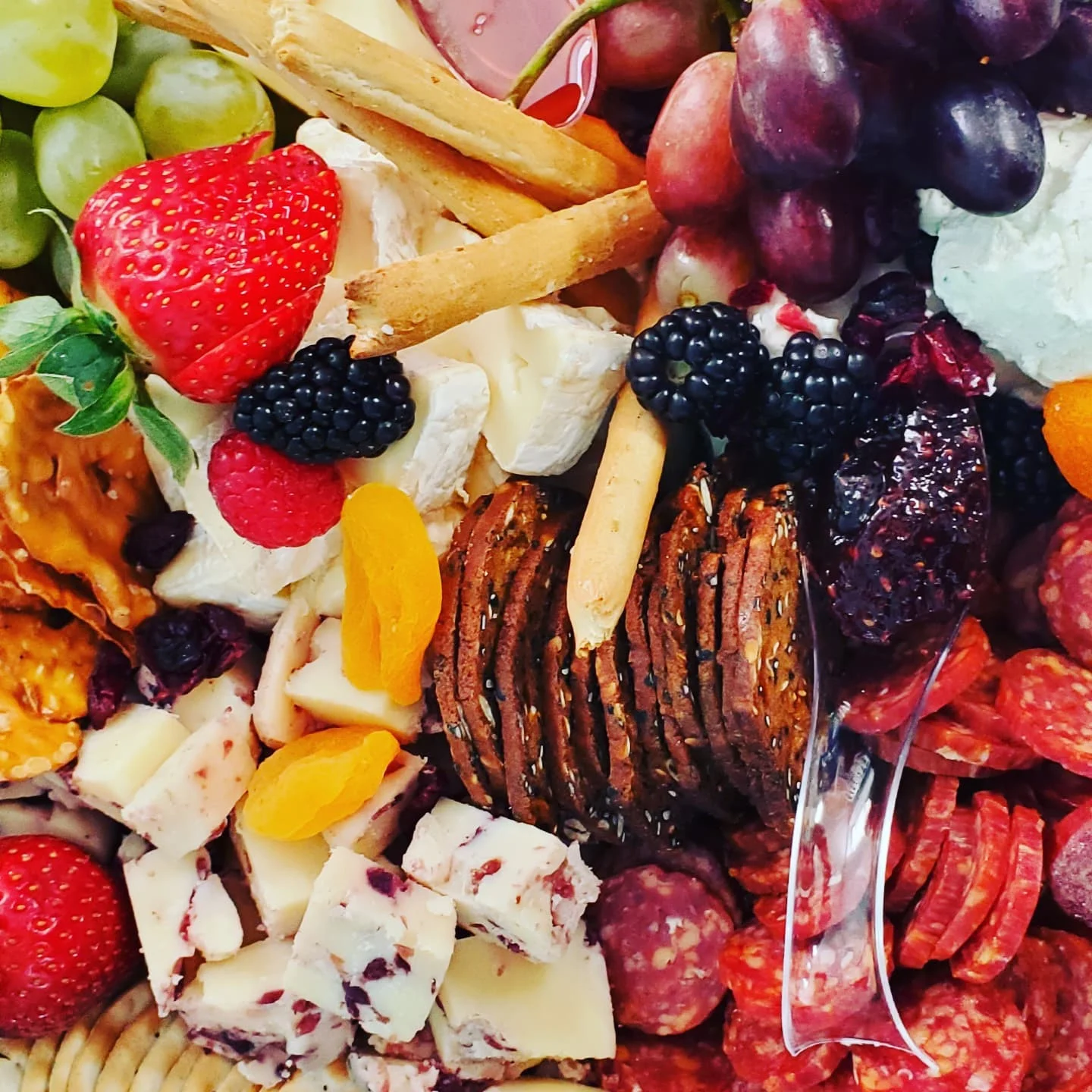 Artisan cheese platter with fruits and crackers