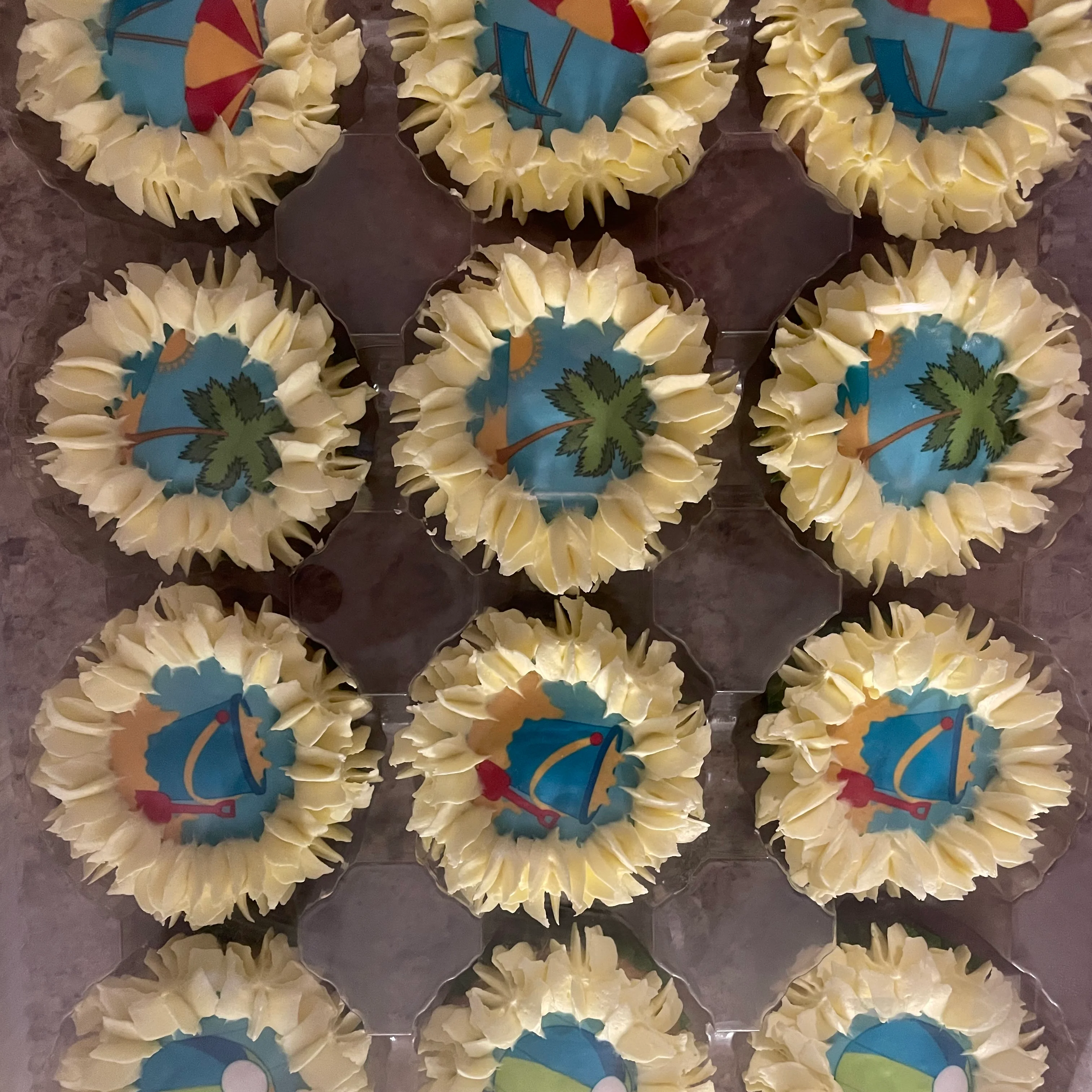 Colorful beach-themed cupcakes with decorative frosting