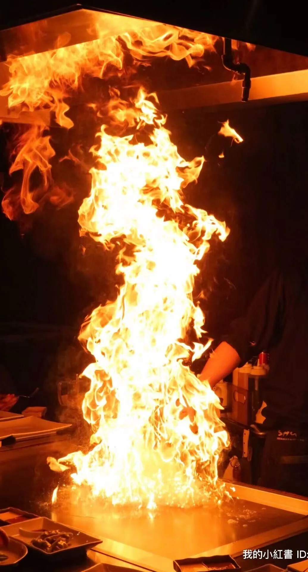 Flaming teppanyaki grill performance at a Japanese restaurant