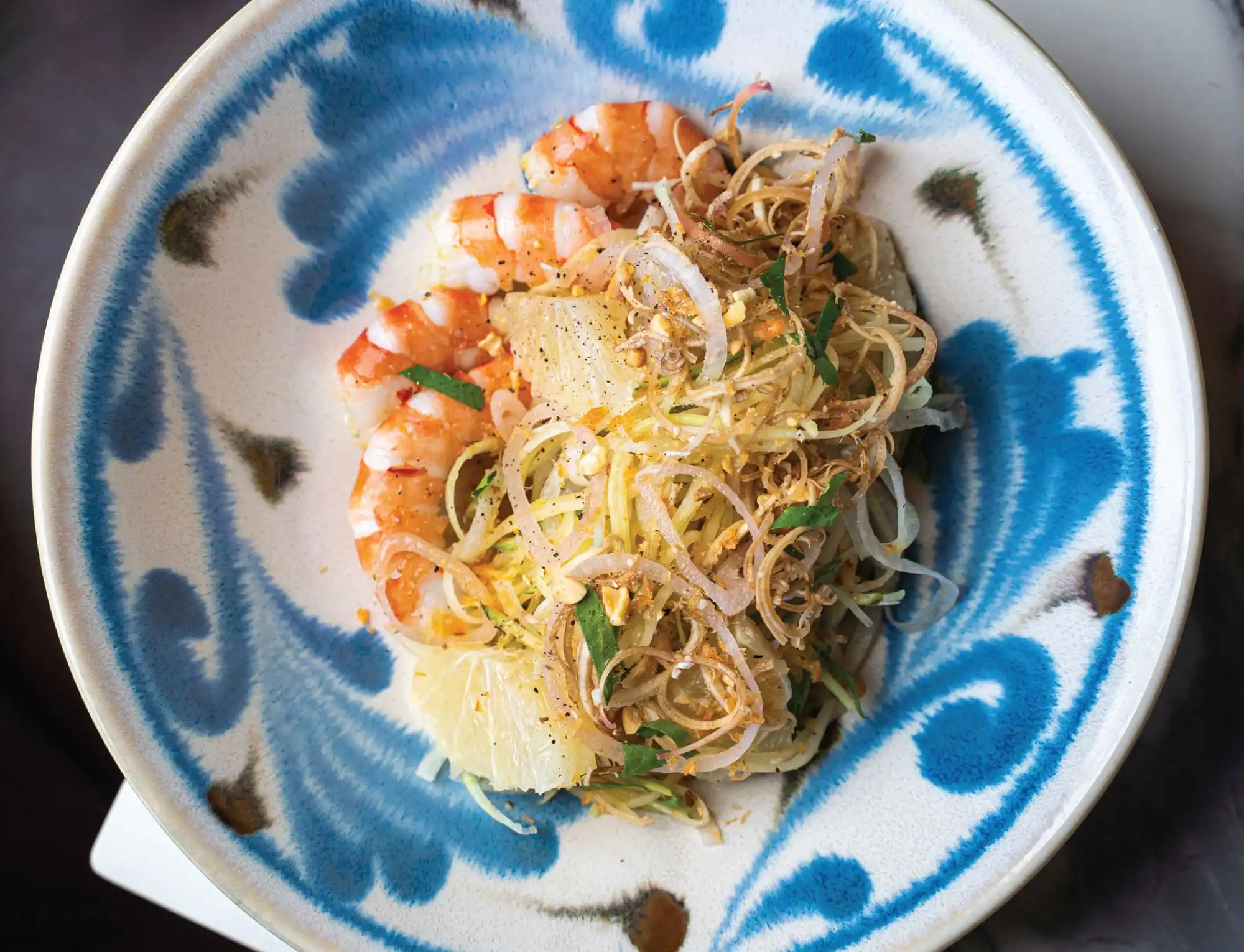 Poached Shrimp SALAD Green Papaya, Cucumber, Banana Blossoms, Pickled Lotus Stem, Rau Răm, Crispy Shallots and Garlic, Peanuts, Citrus Vinaigrette.