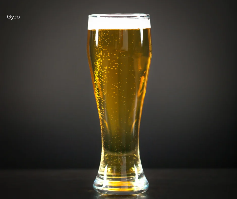 Chilled glass of golden beer with bubbles