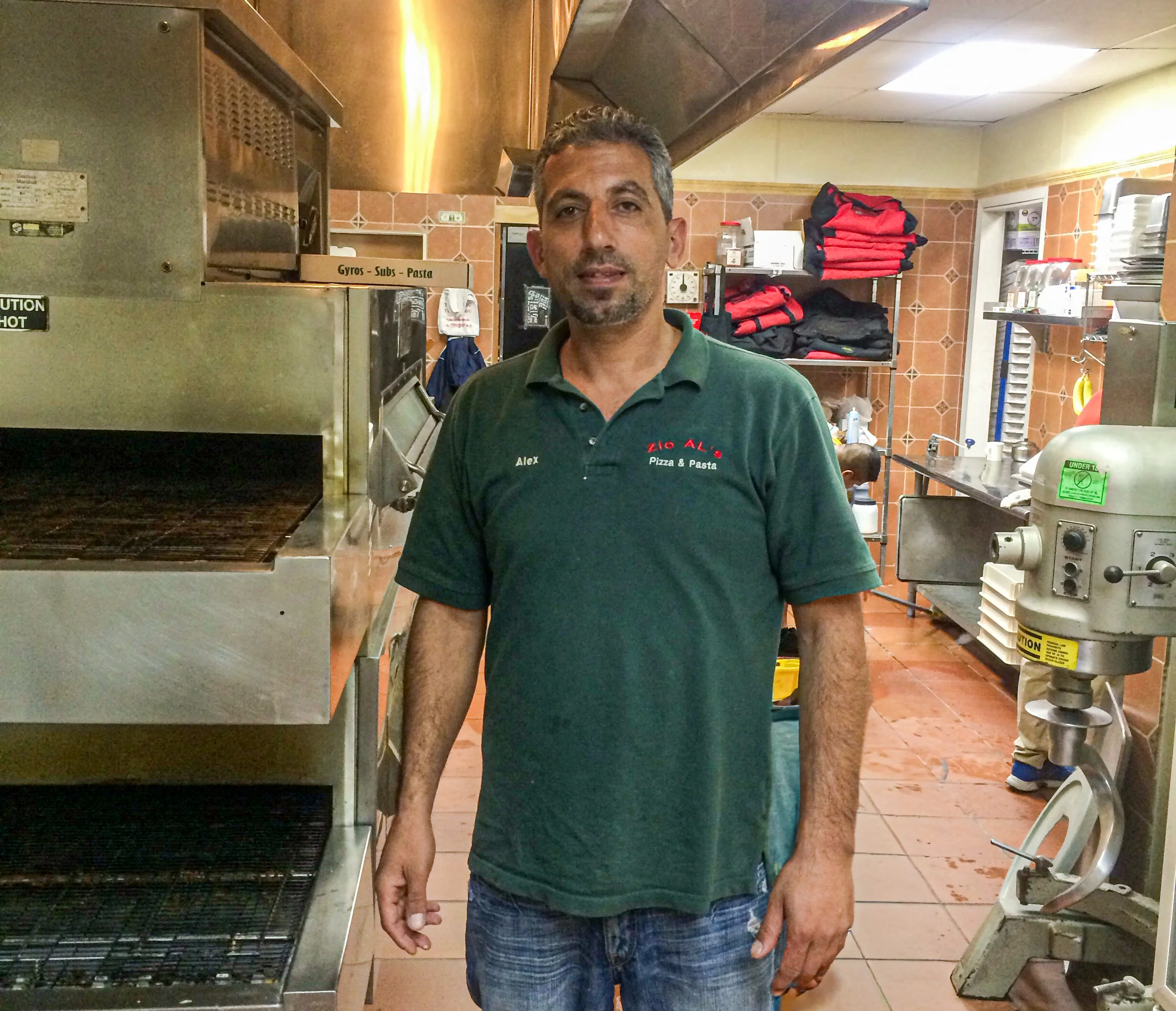 Chef in a bustling restaurant kitchen