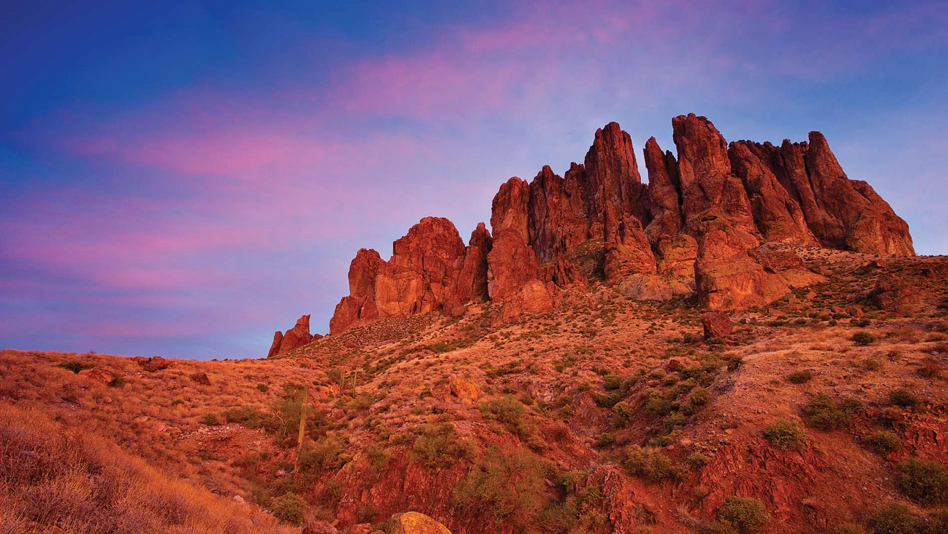 Majestic rock formations at sunset in a desert landscape