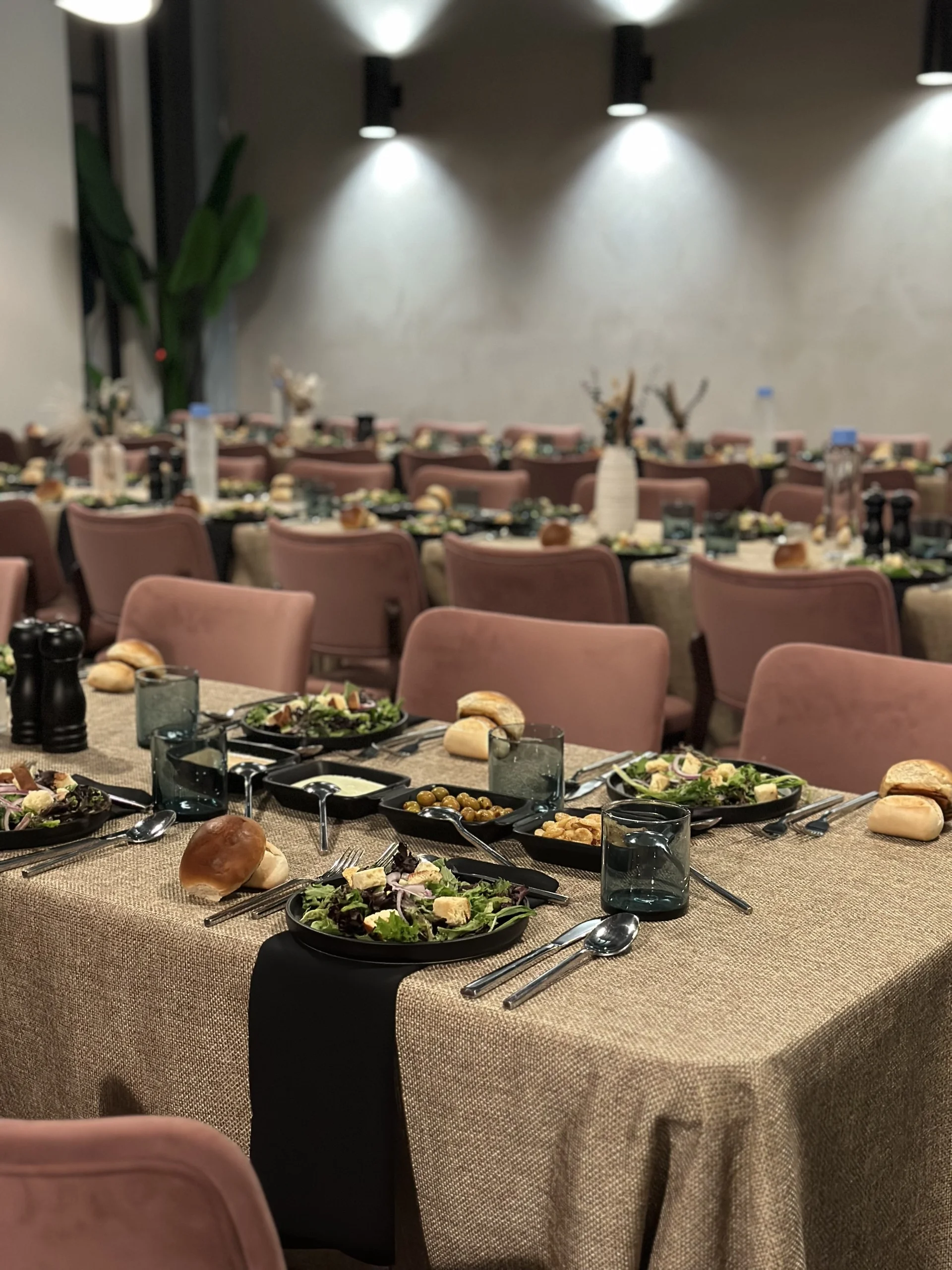 Spacious party room with elegant decor and seating arrangements.