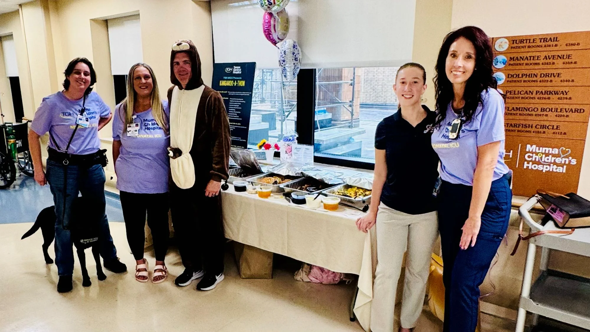 Hospital staff celebrating with food at Muma Children's Hospital event