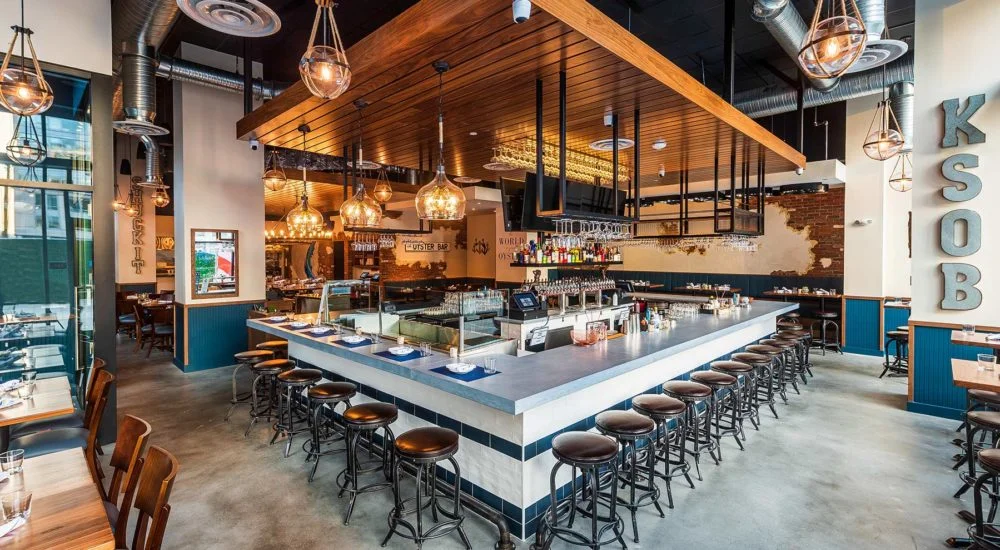 Modern restaurant interior with a stylish bar and warm lighting