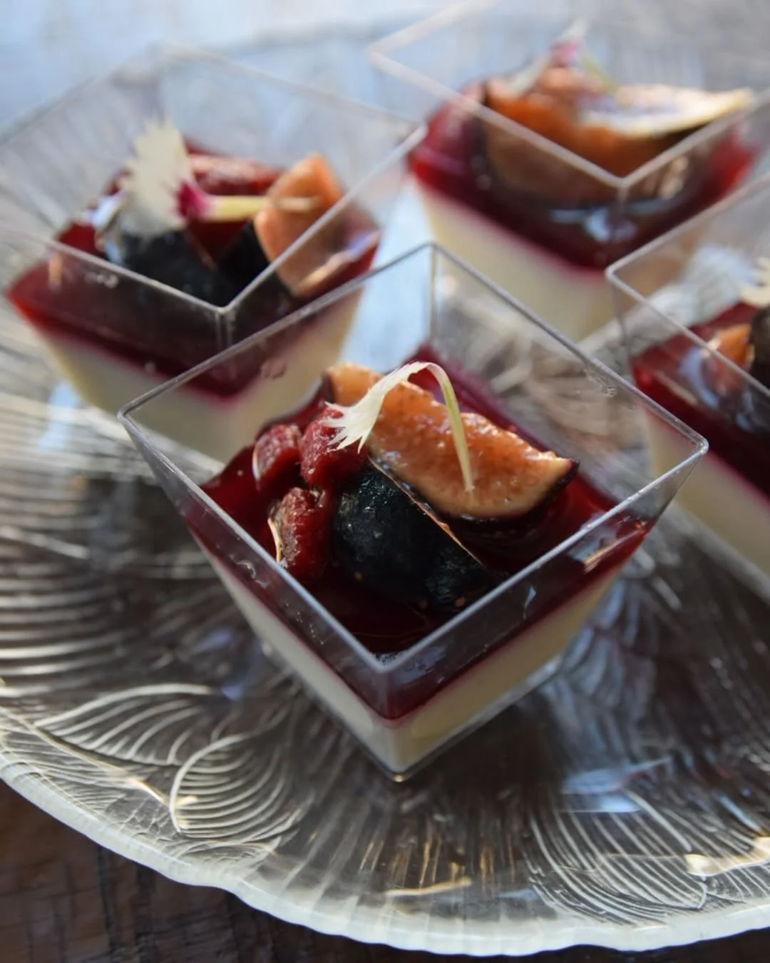 Elegant panna cotta with berry compote and fresh figs