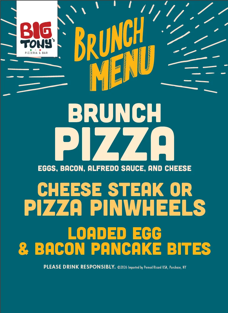 Brunch pizza featuring eggs and bacon at a pizzeria