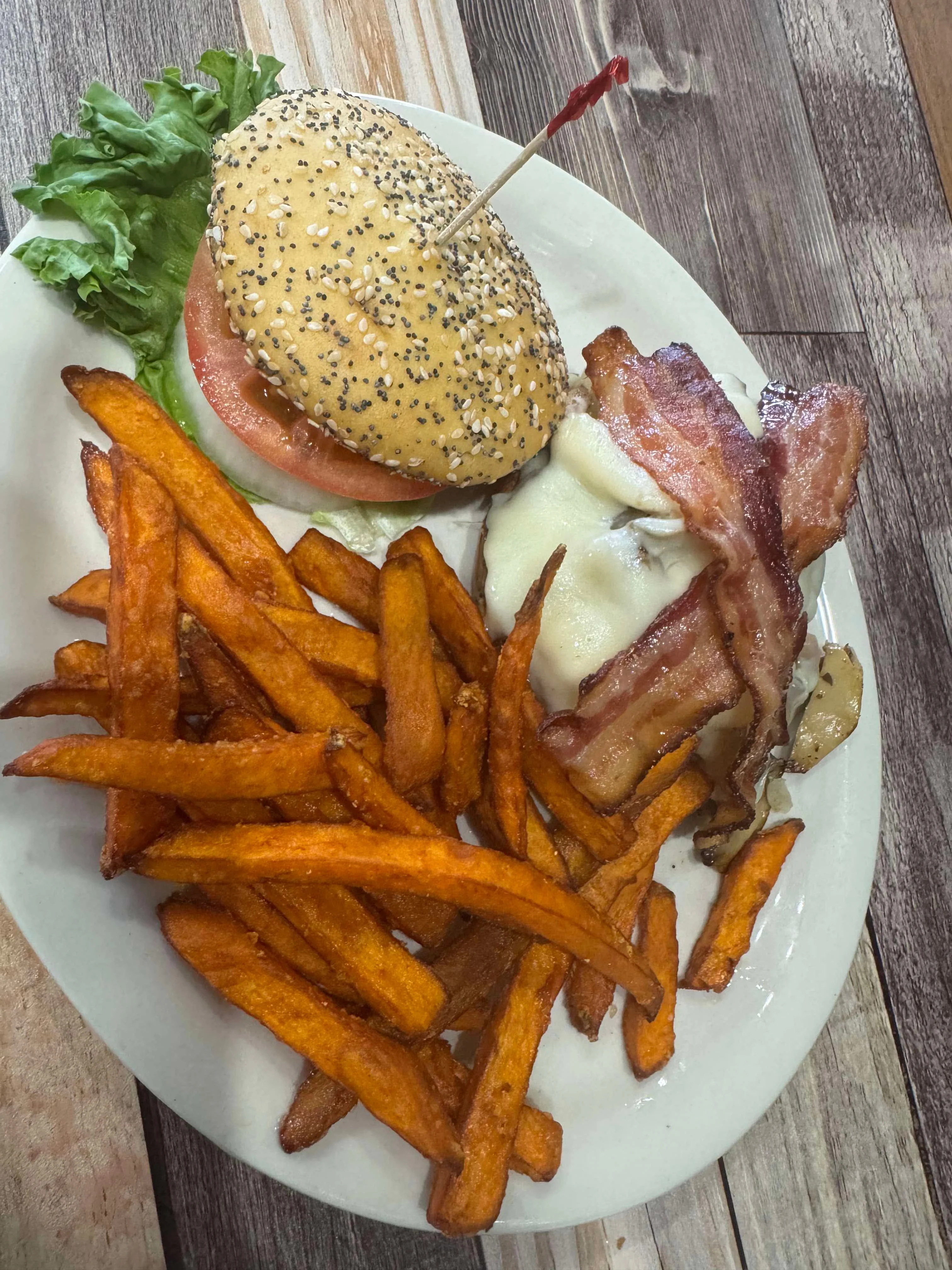Classic American cheeseburger with sweet potato fries