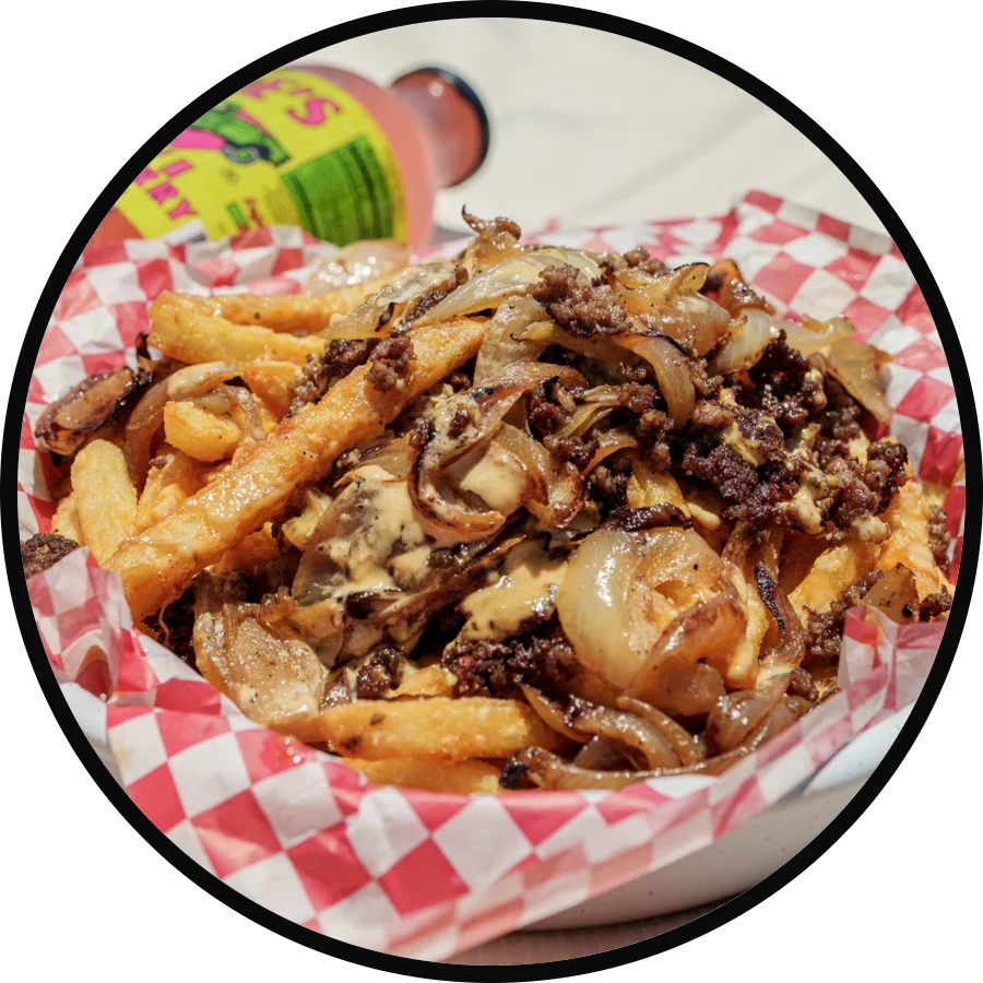 Loaded Canadian poutine with beef and onions