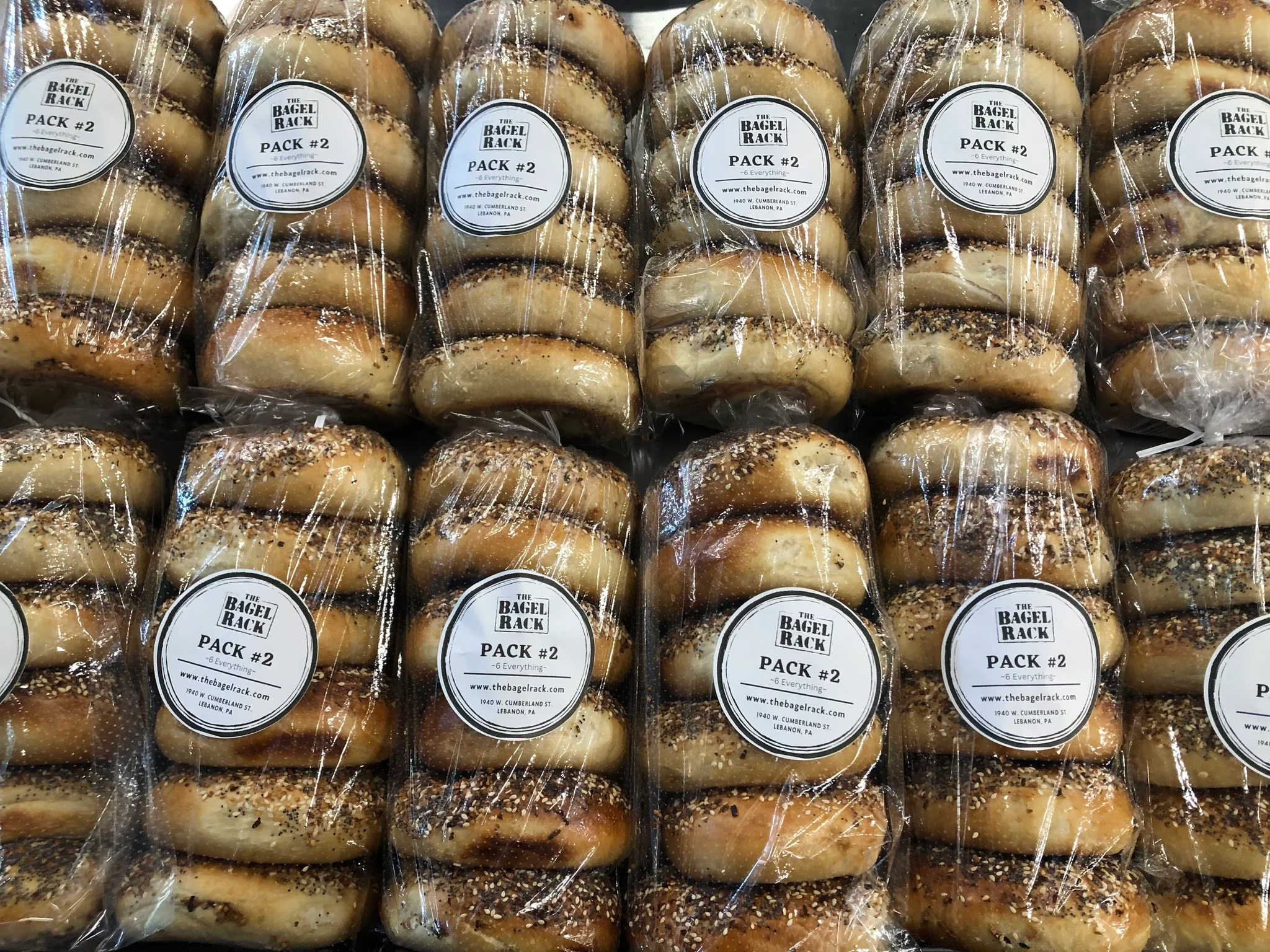 Pack of assorted New York-style bagels in clear packaging