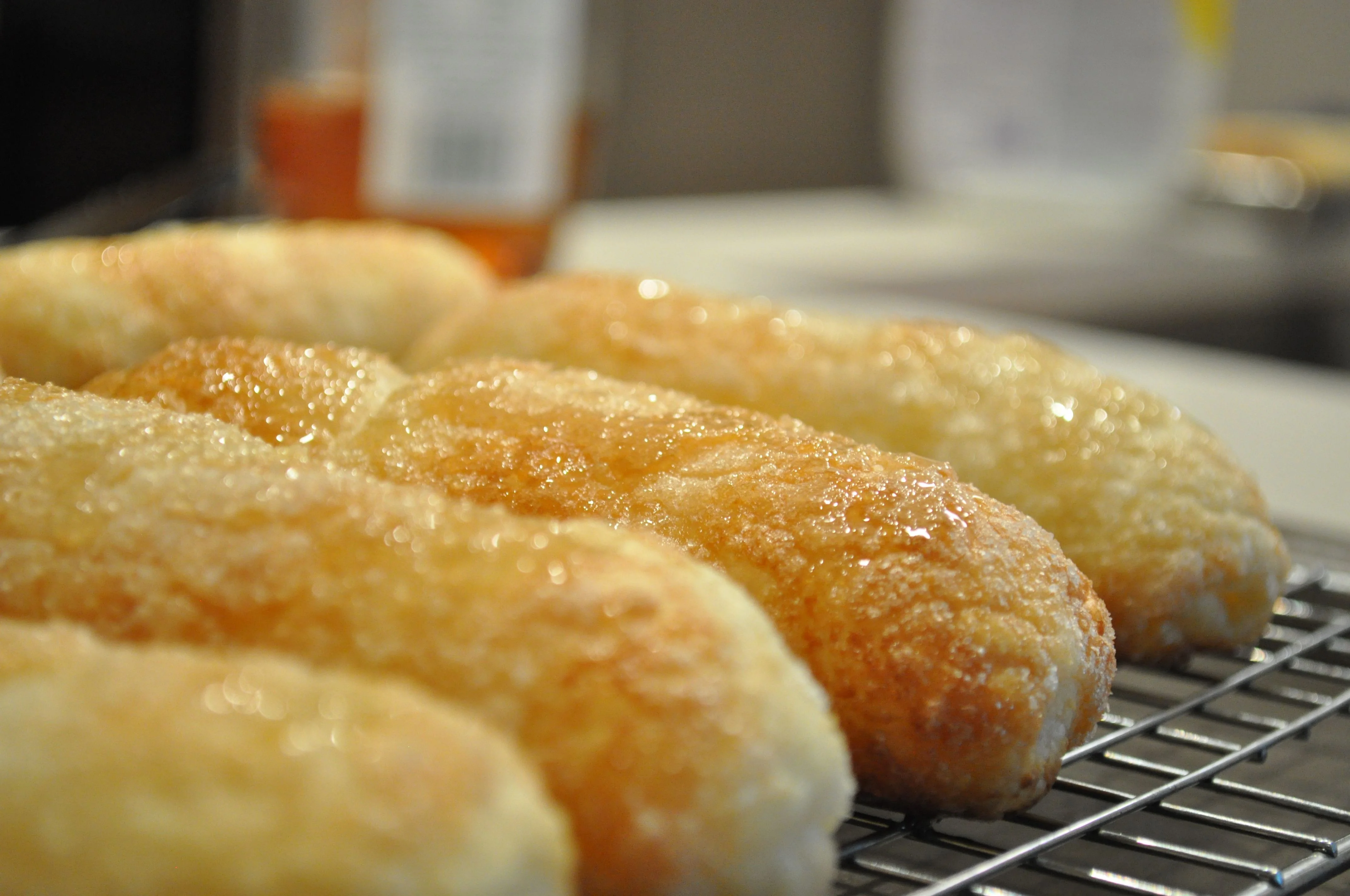 Freshly baked Brazilian pão de queijo cooling on a wire rack