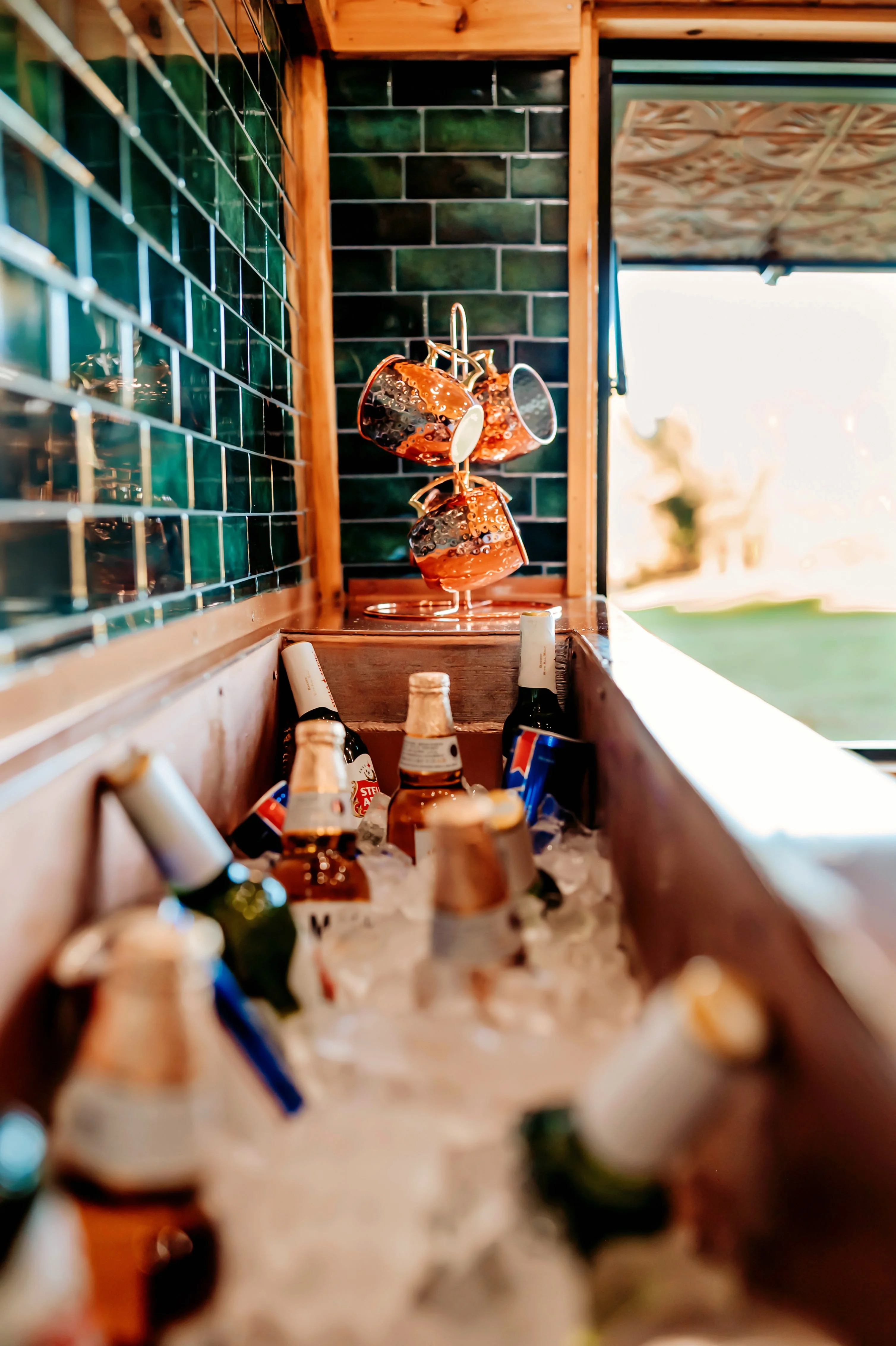 Chilled drinks in a rustic bar with green tile backdrop