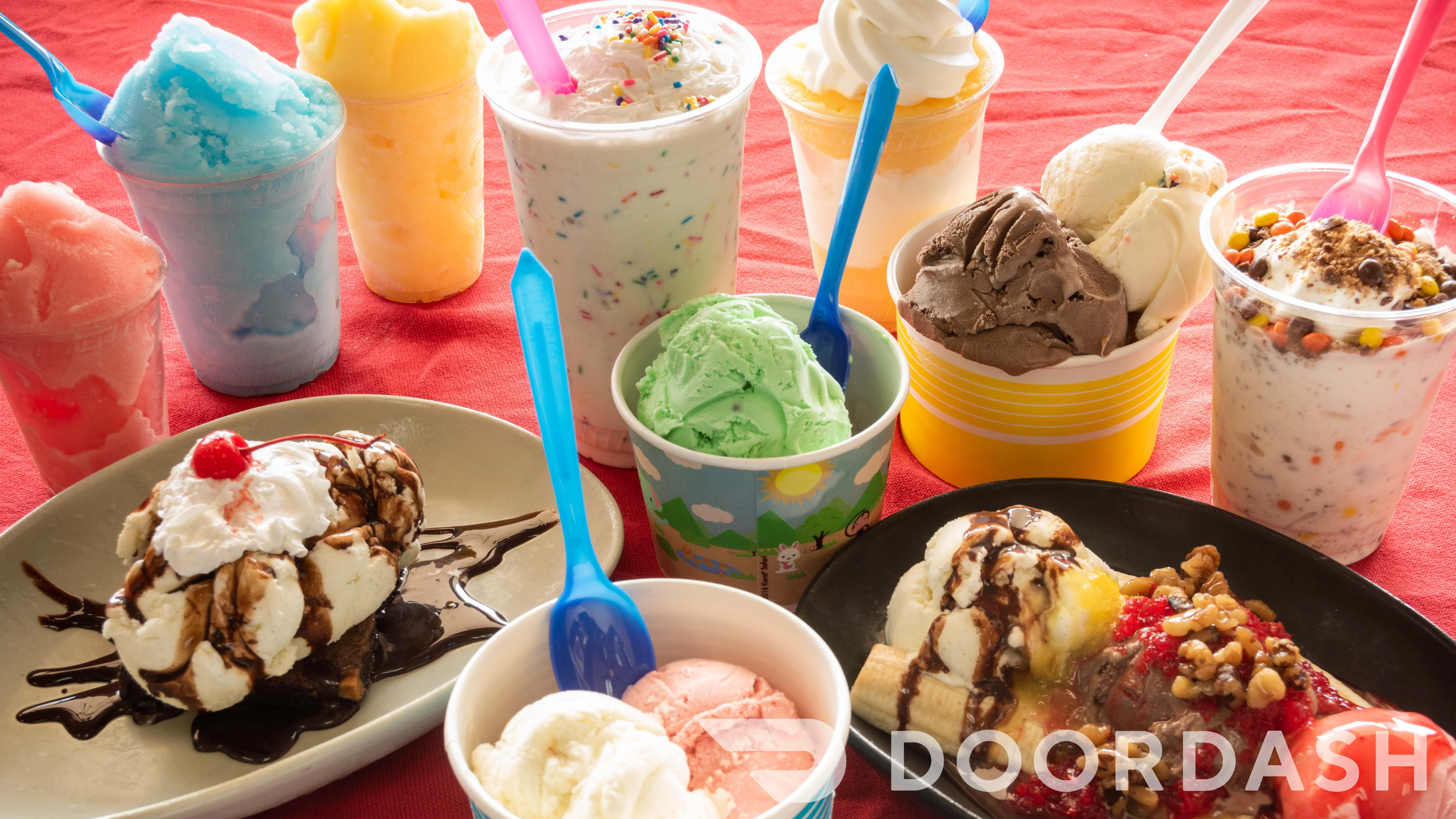 Assorted ice cream sundaes and shakes in colorful cups