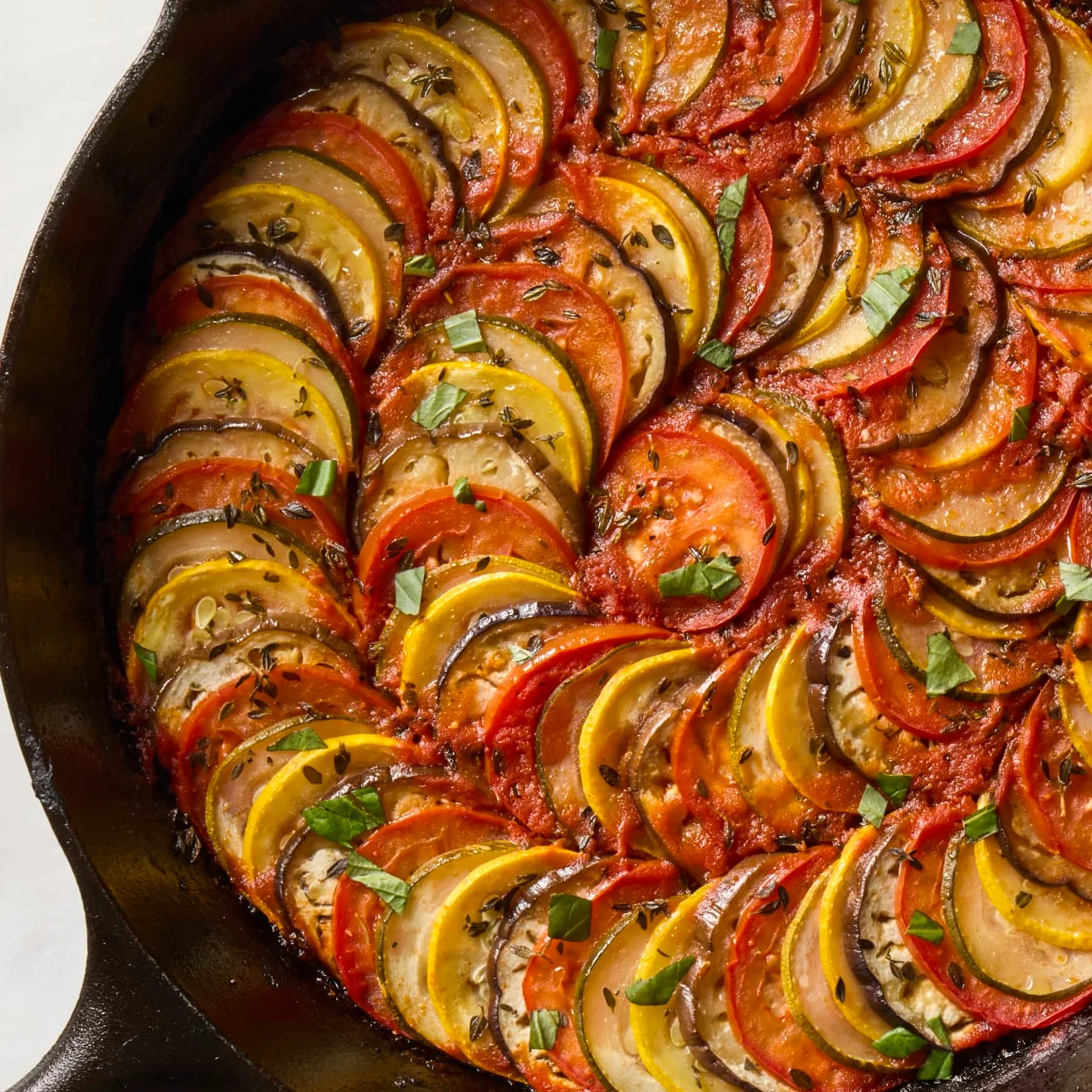Colorful ratatouille baked in a cast iron skillet