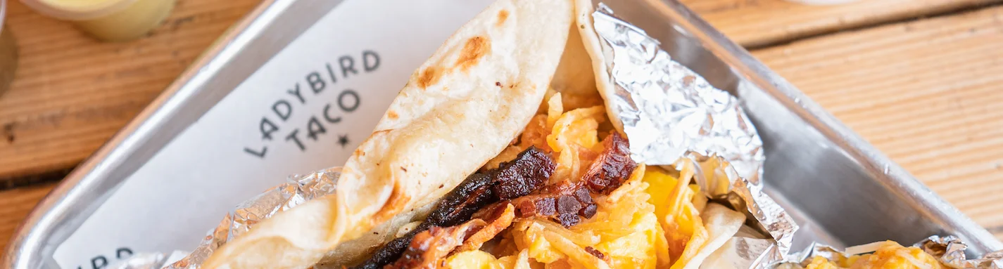Delicious breakfast taco with crispy bacon