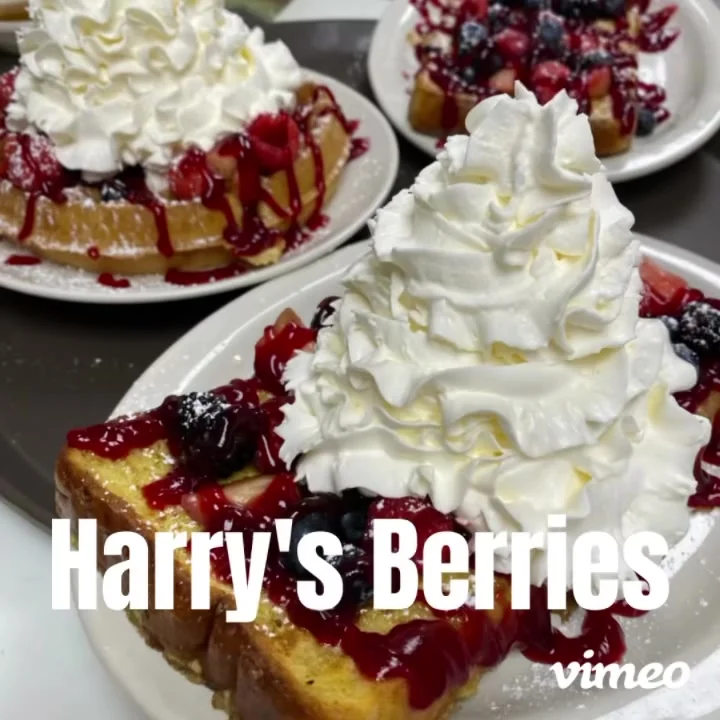 Delicious French toast topped with whipped cream and mixed berries