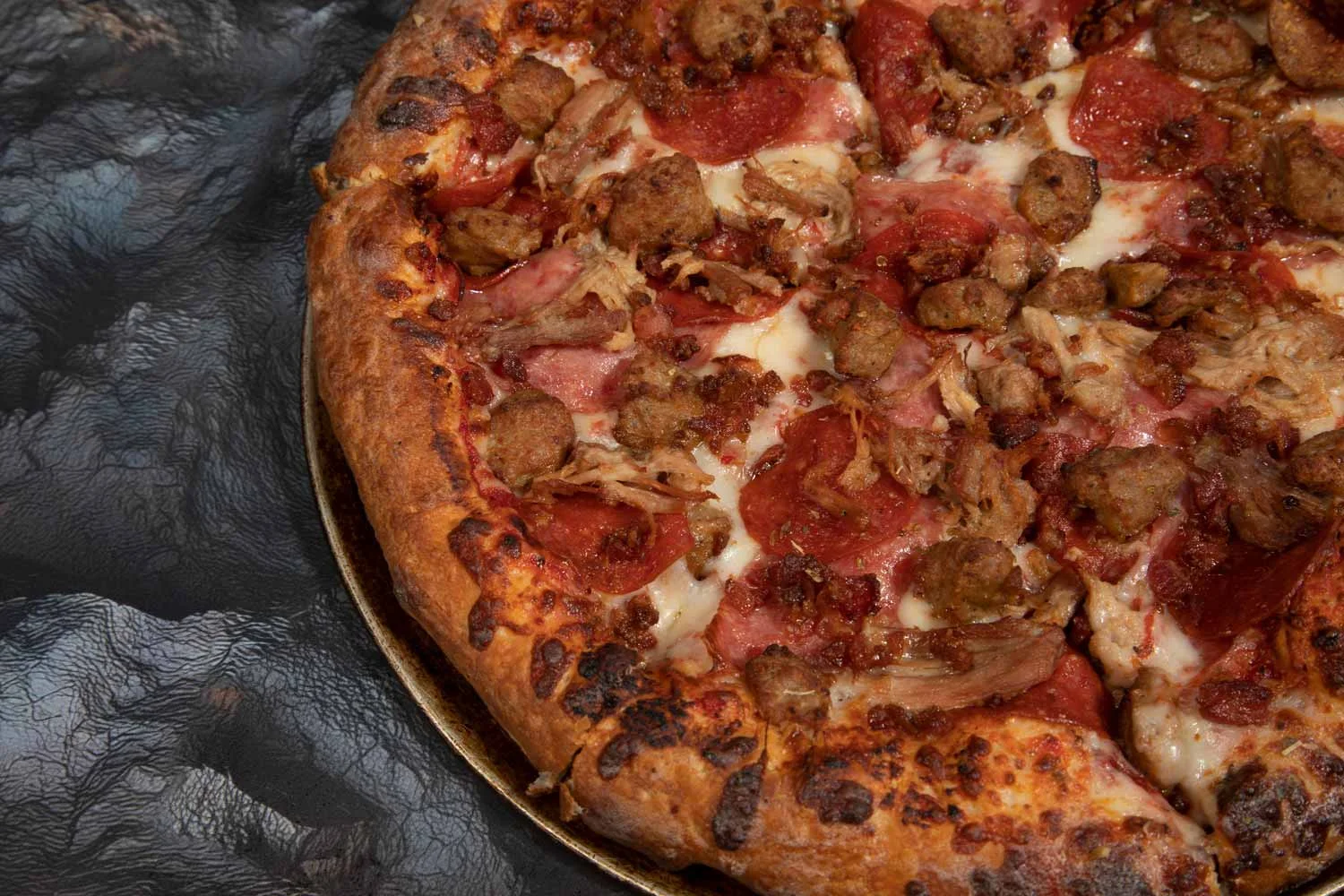 Loaded meat lover's pizza with pepperoni and sausage