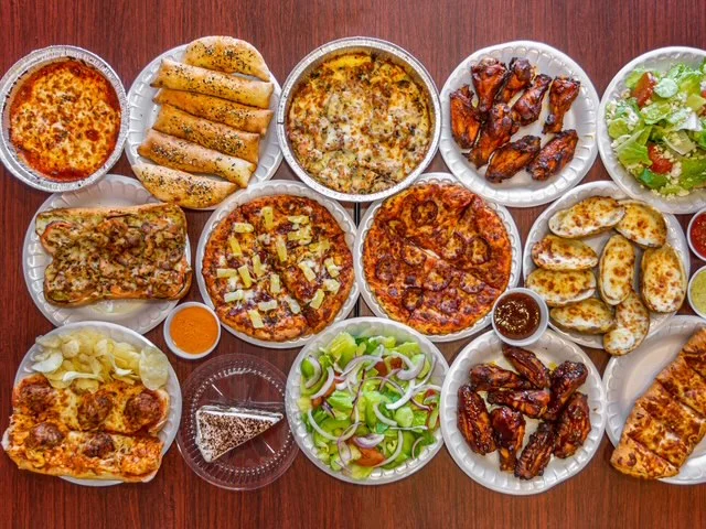 Assorted pizza and wings platter for a casual feast