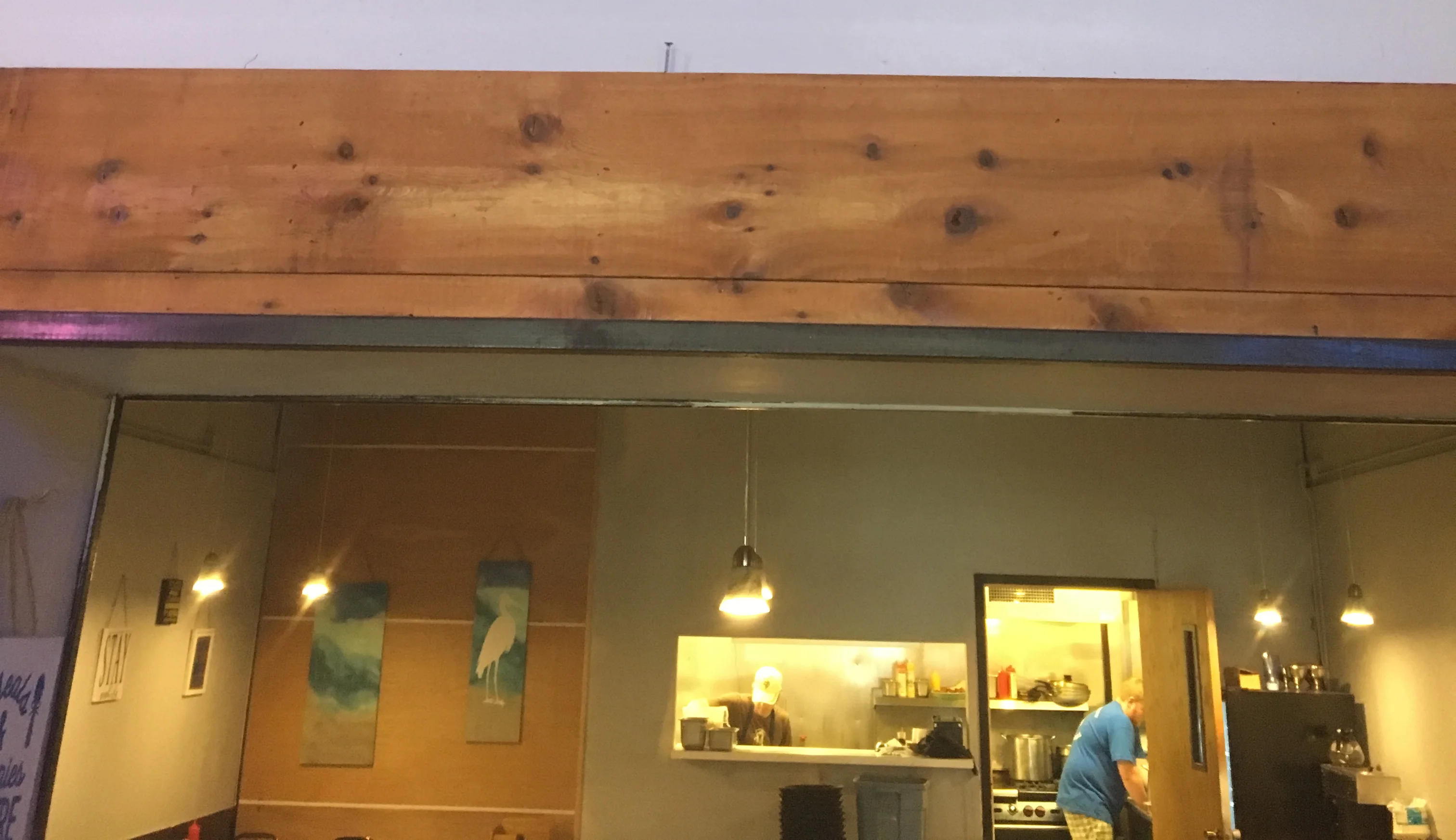 Signage for The Blue Heron Bar & Grill featuring a heron illustration