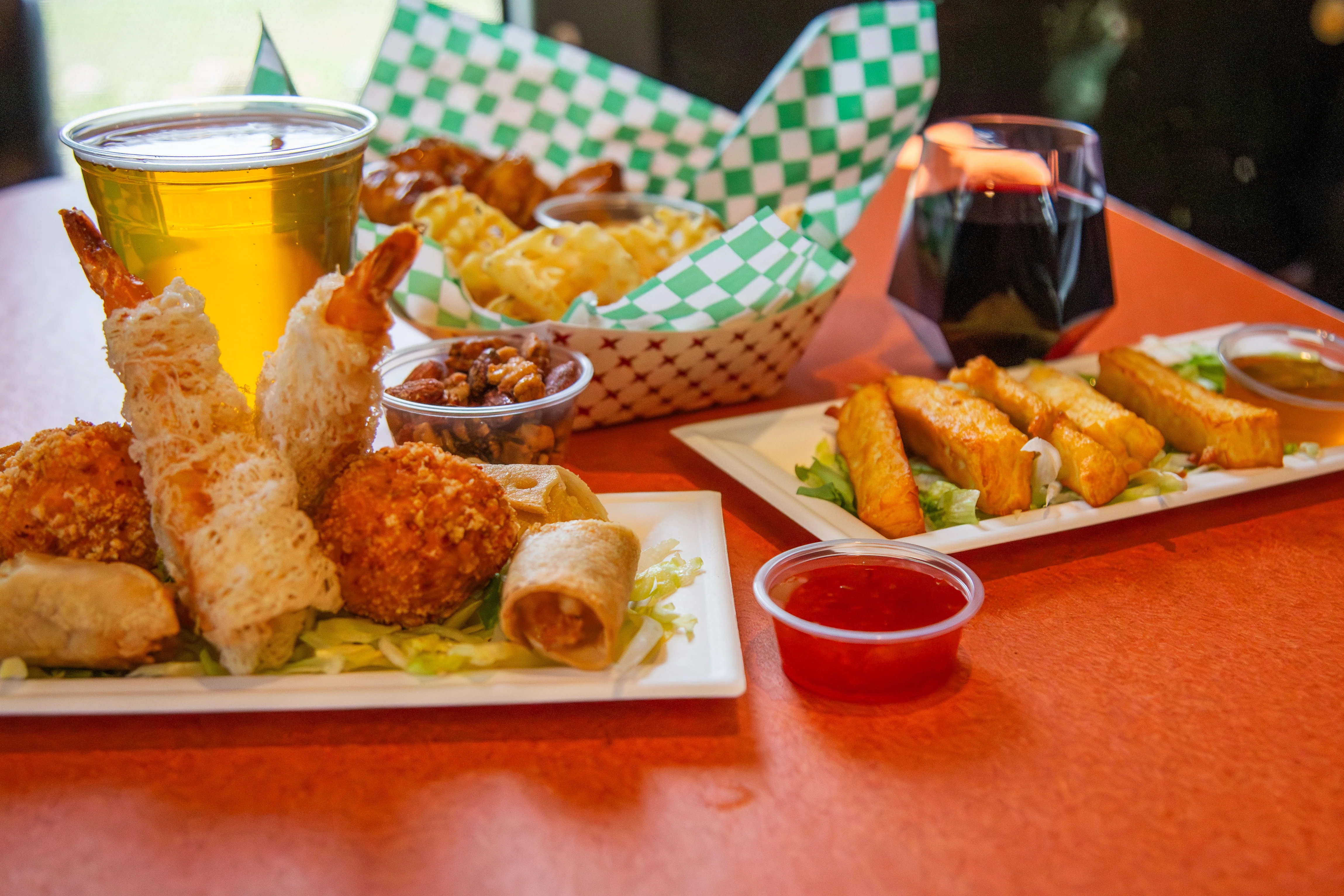 Assorted Asian appetizers with beer and wine