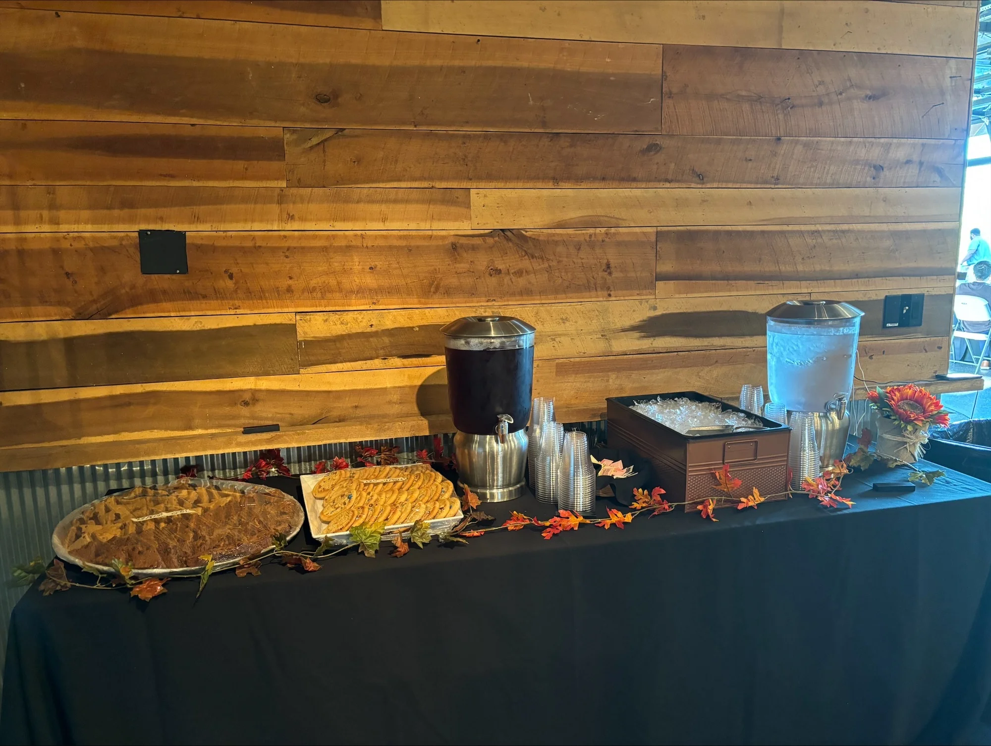 Dessert table with assorted cookies and cake in a rustic setting