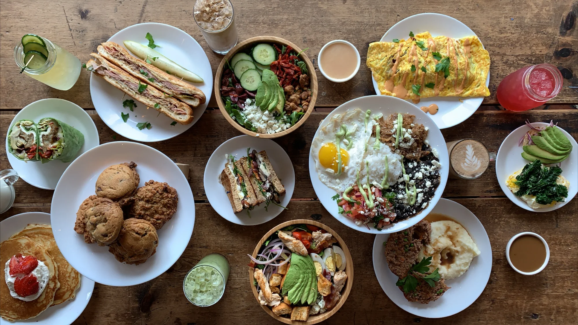 Variety of brunch dishes including omelette and sandwiches