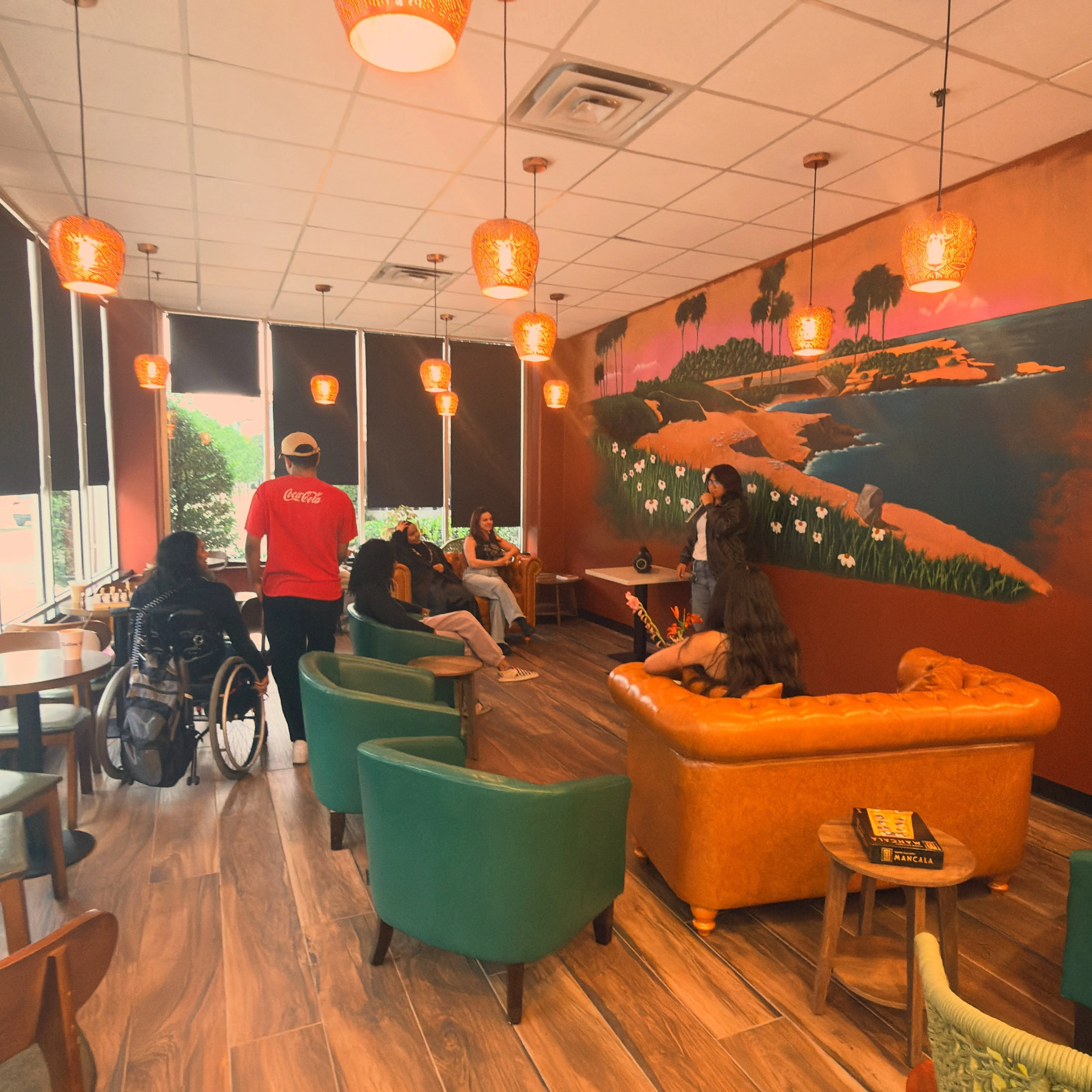 Cozy restaurant interior with vibrant mural and warm lighting