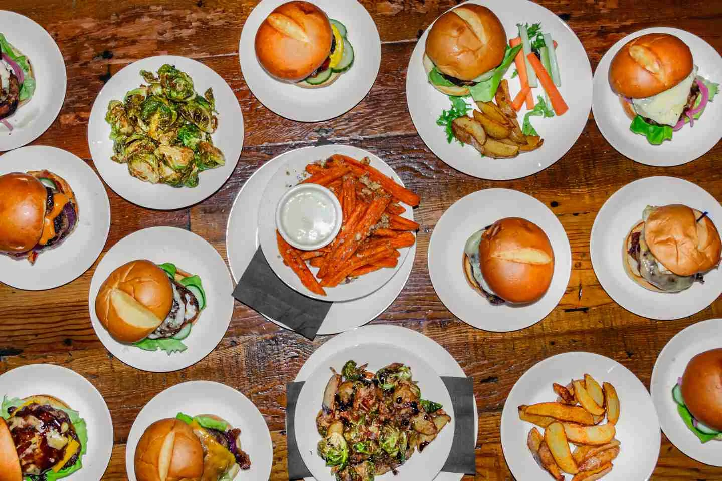 A selection of options from The Bistro including burgers, Brussels sprouts, and sweet potato fries