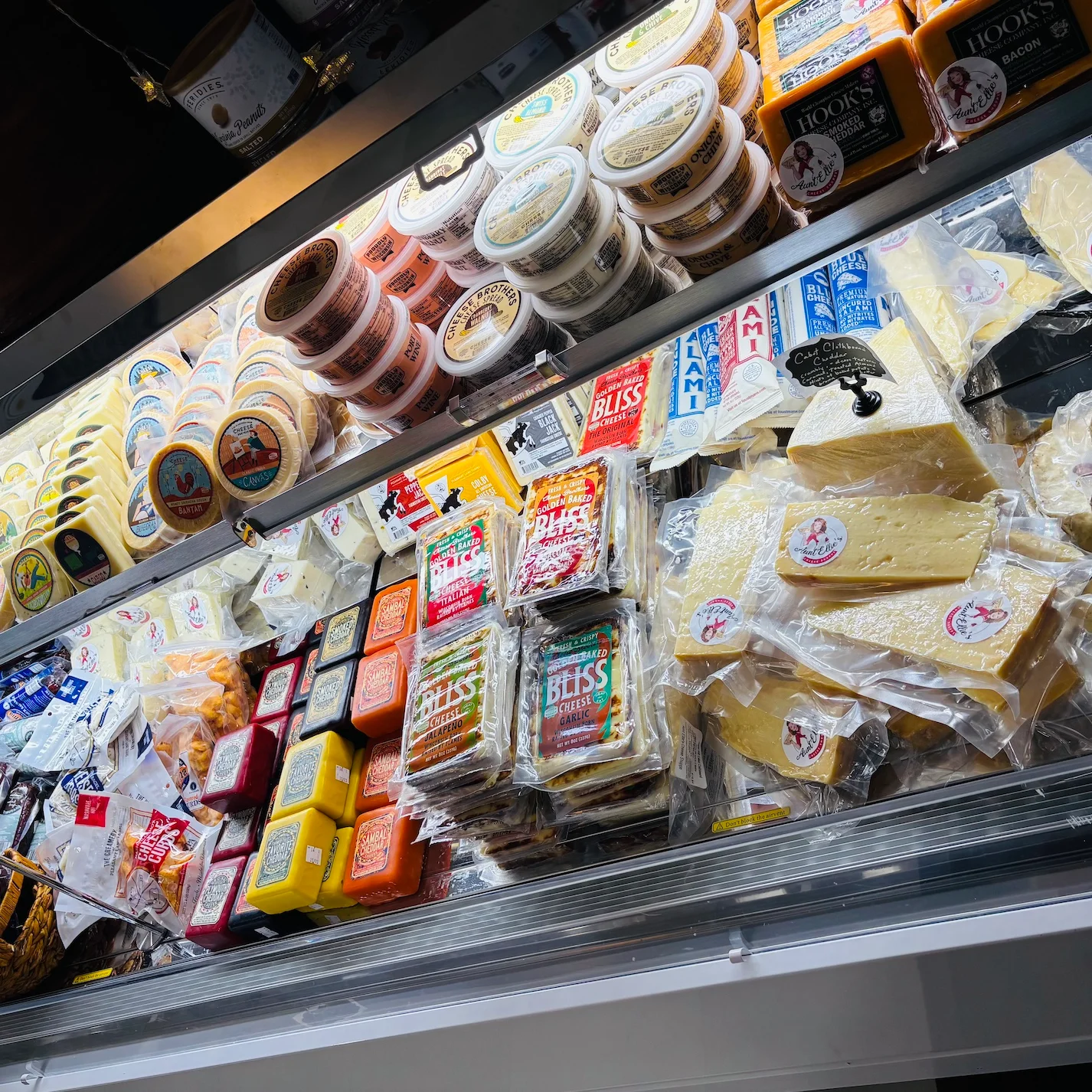 Cheeses stocked on a shelf