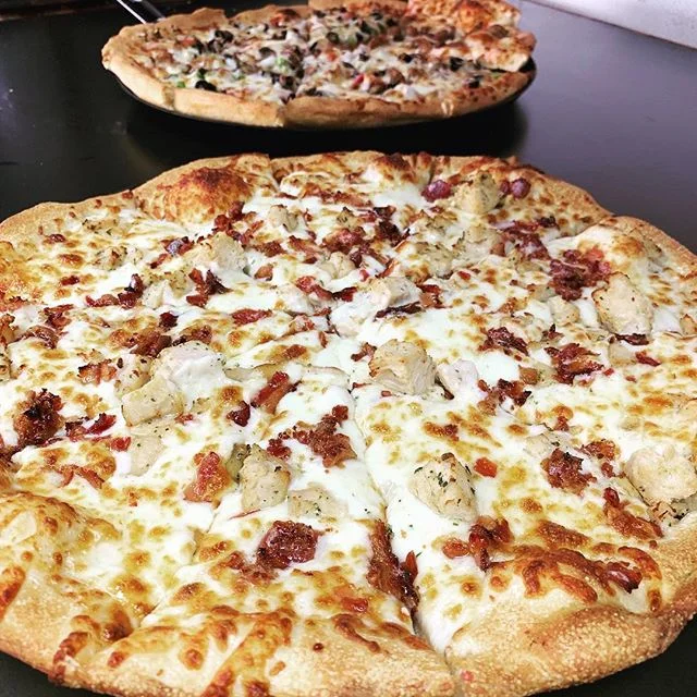 Delicious chicken bacon pizza with melted cheese