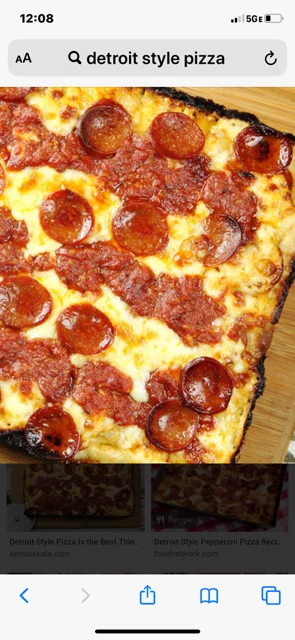 Detroit-style pizza with pepperoni and marinara sauce