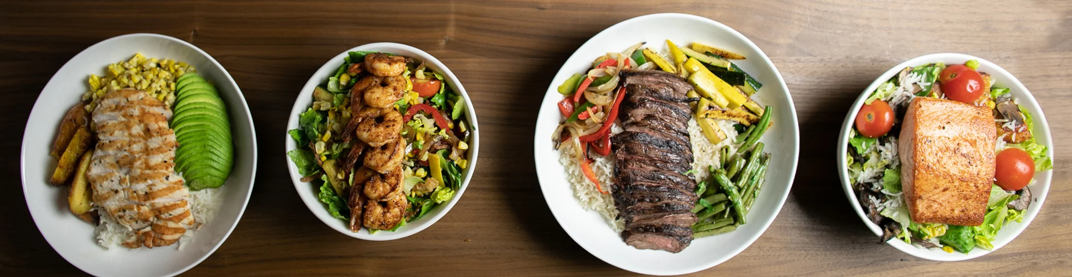 Colorful Latin American feast featuring grilled meats and fresh vegetables