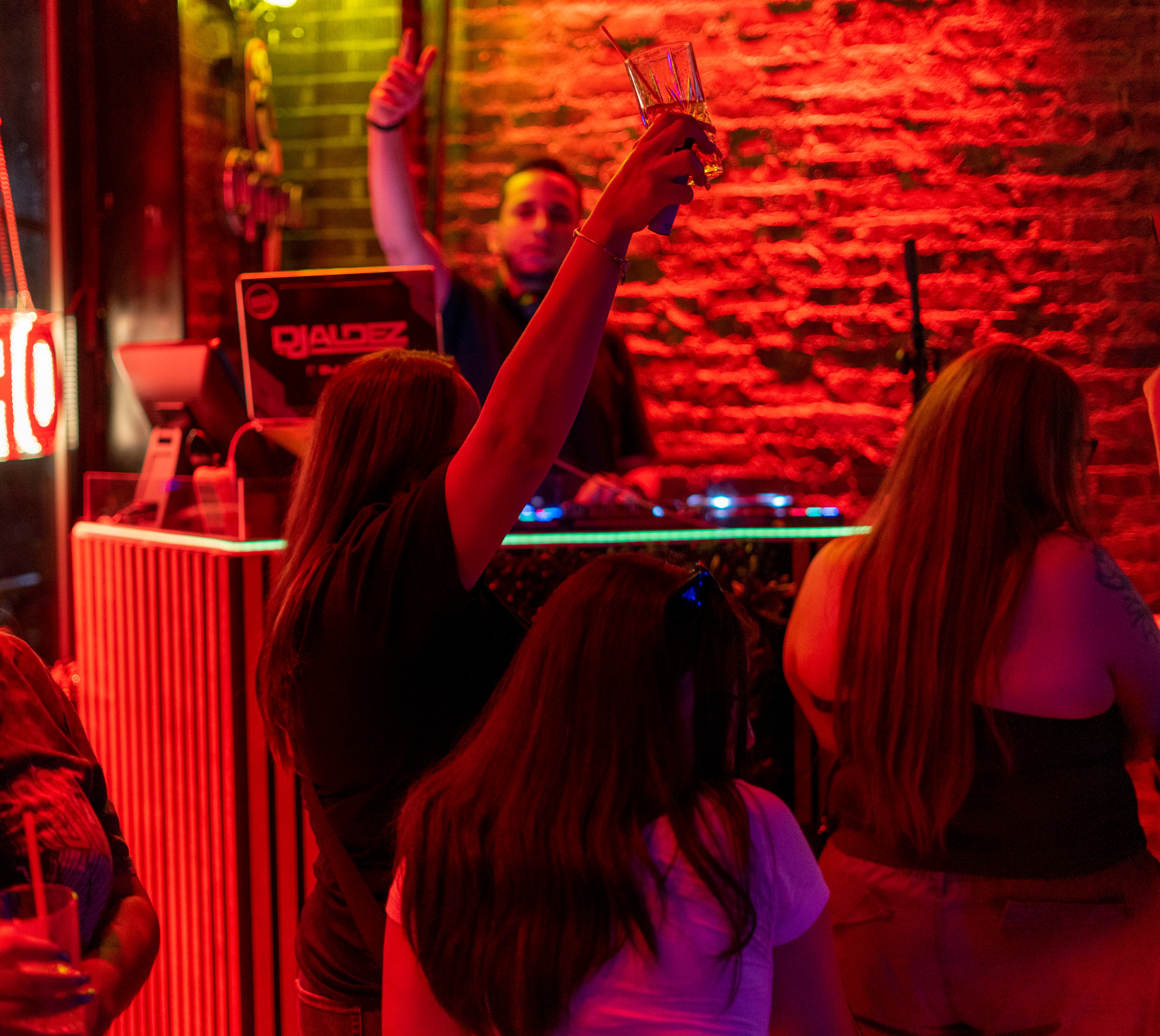 Friends enjoying cocktails at a vibrant bar