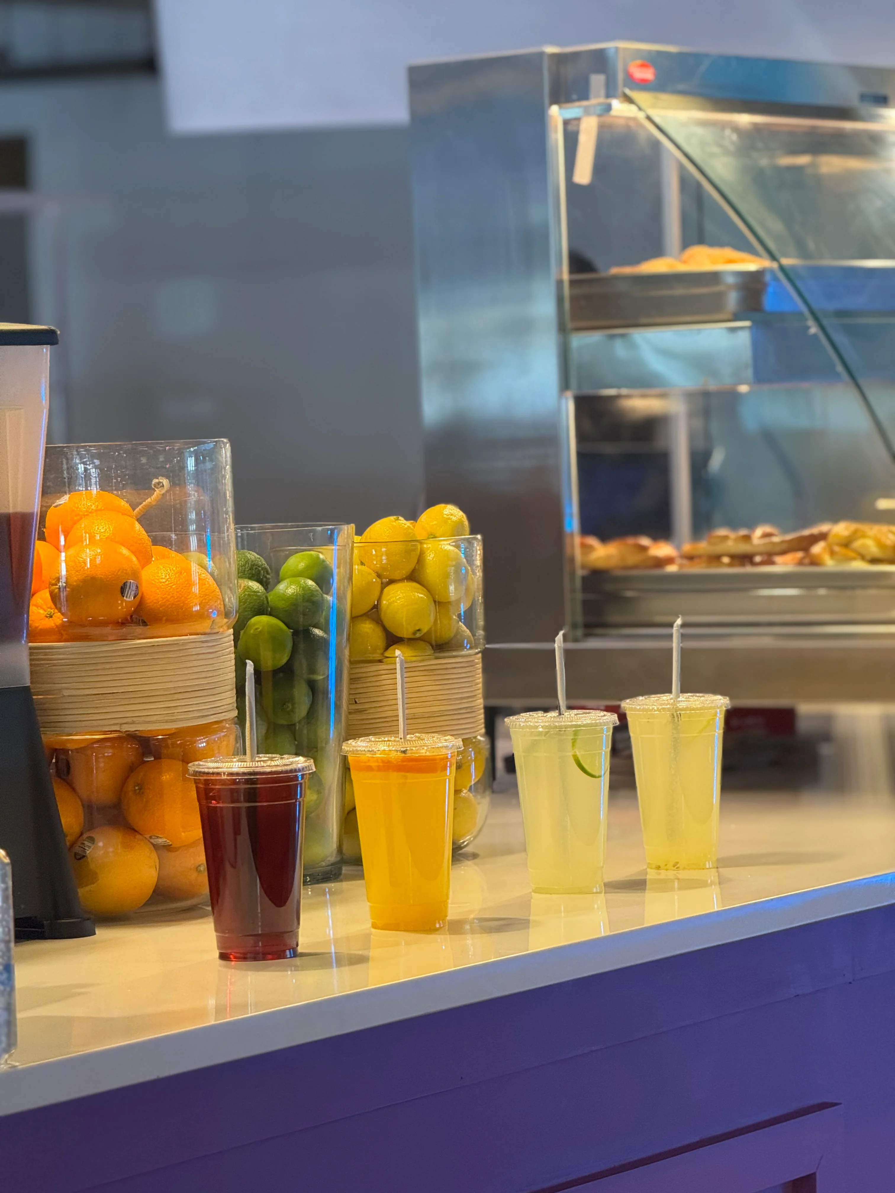 Colorful assortment of refreshing beverages at a vibrant restaurant counter