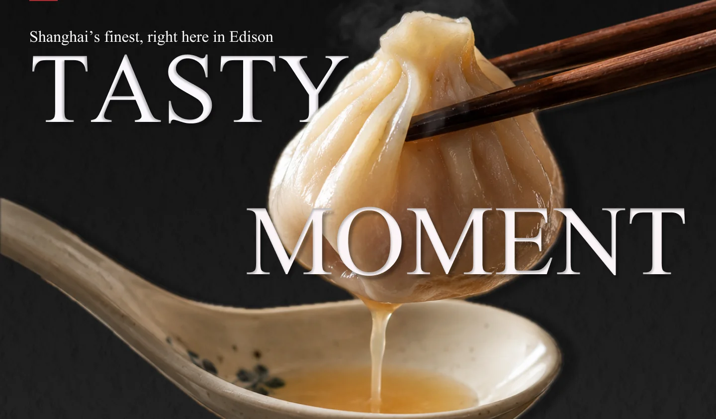 Steaming xiaolongbao dumpling served with chopsticks