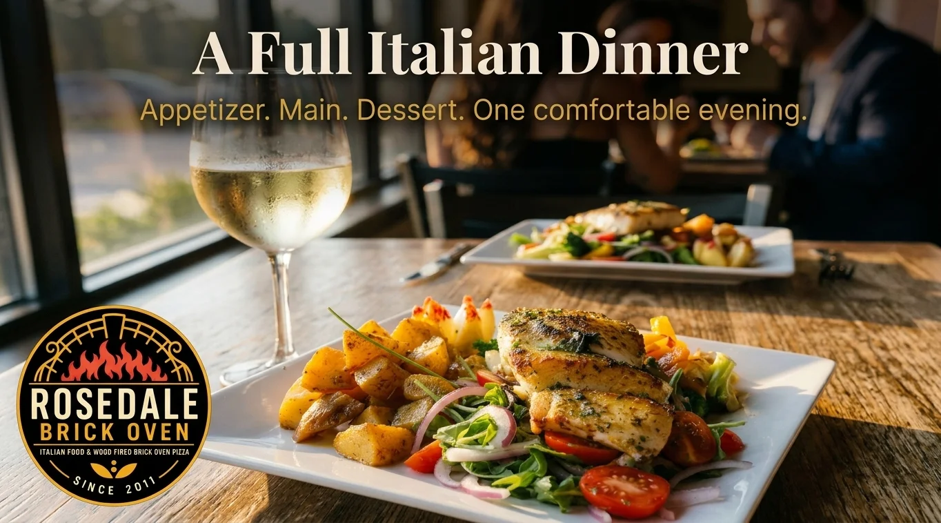 Italian dinner featuring grilled fish, roasted potatoes, and fresh salad on a plate