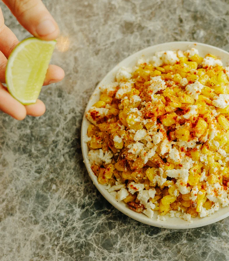 Mexican elote-style corn salad with lime and cheese