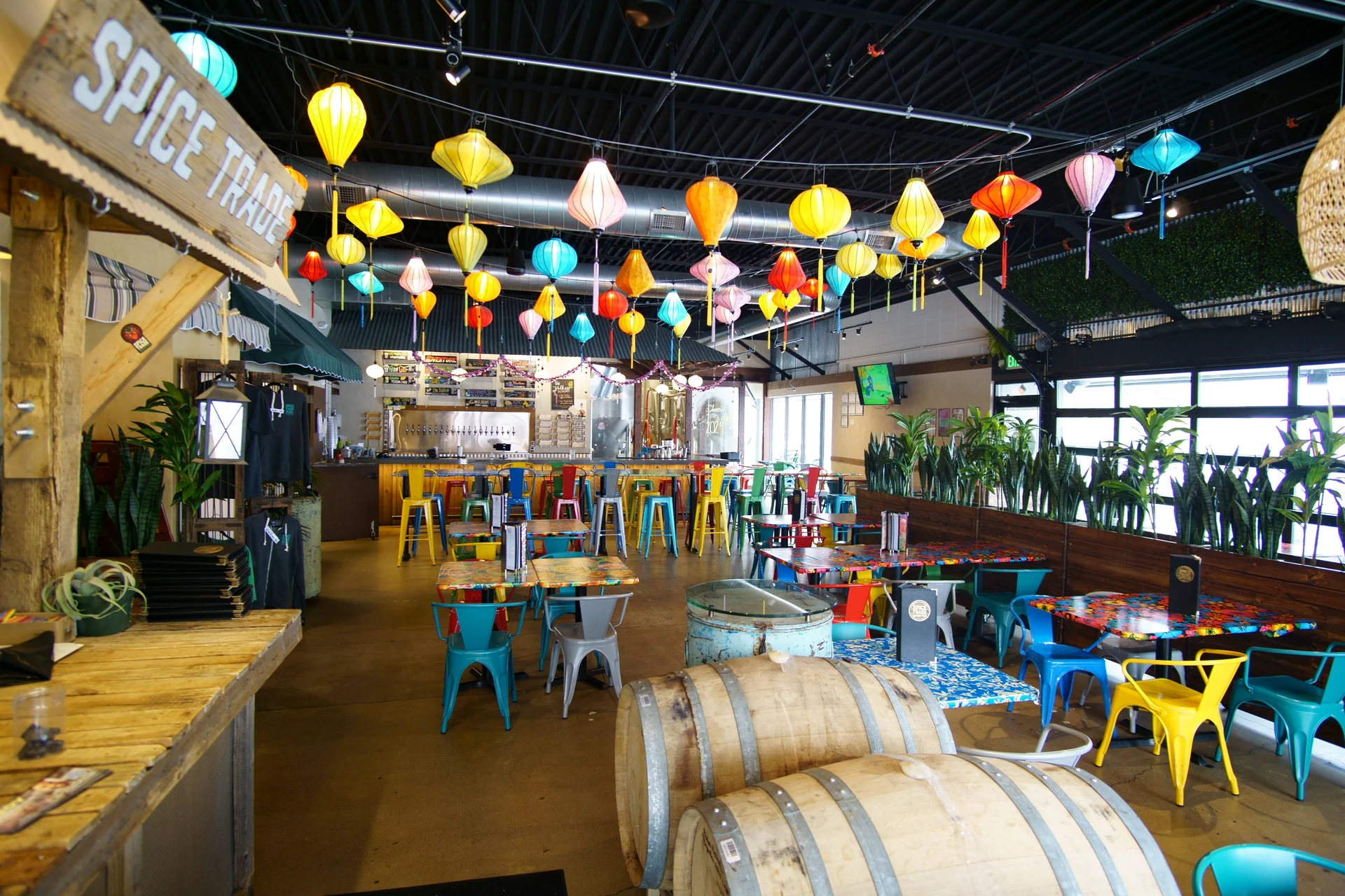 Vibrant restaurant interior with colorful lanterns and eclectic seating