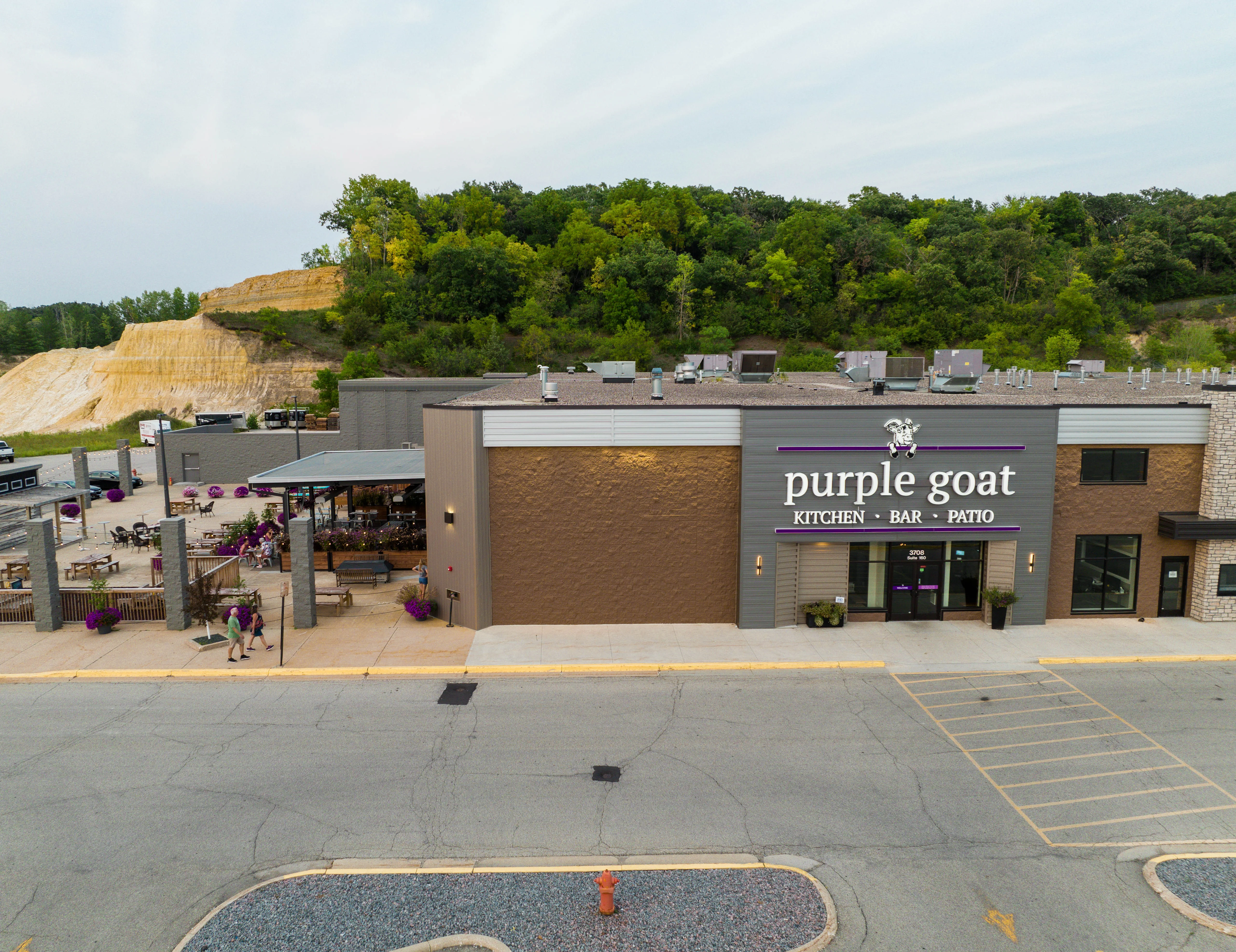 Exterior view of Purple Goat restaurant with patio seating