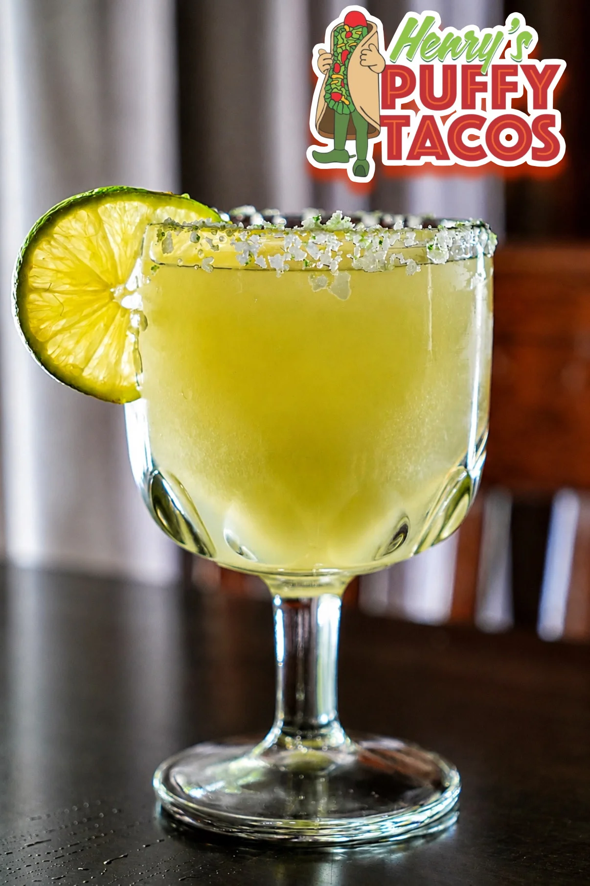 Refreshing cocktail with lime and pineapple garnish