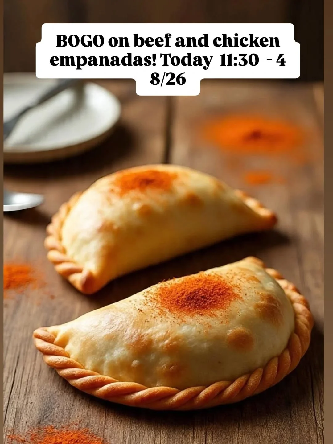 Delicious beef and chicken empanadas on a rustic wooden table