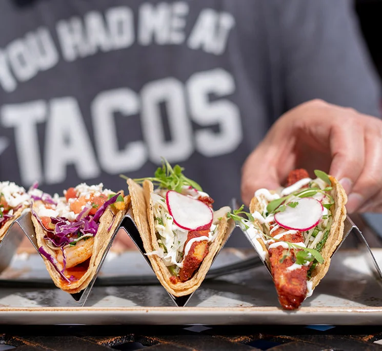 3 tacos in a serving dish