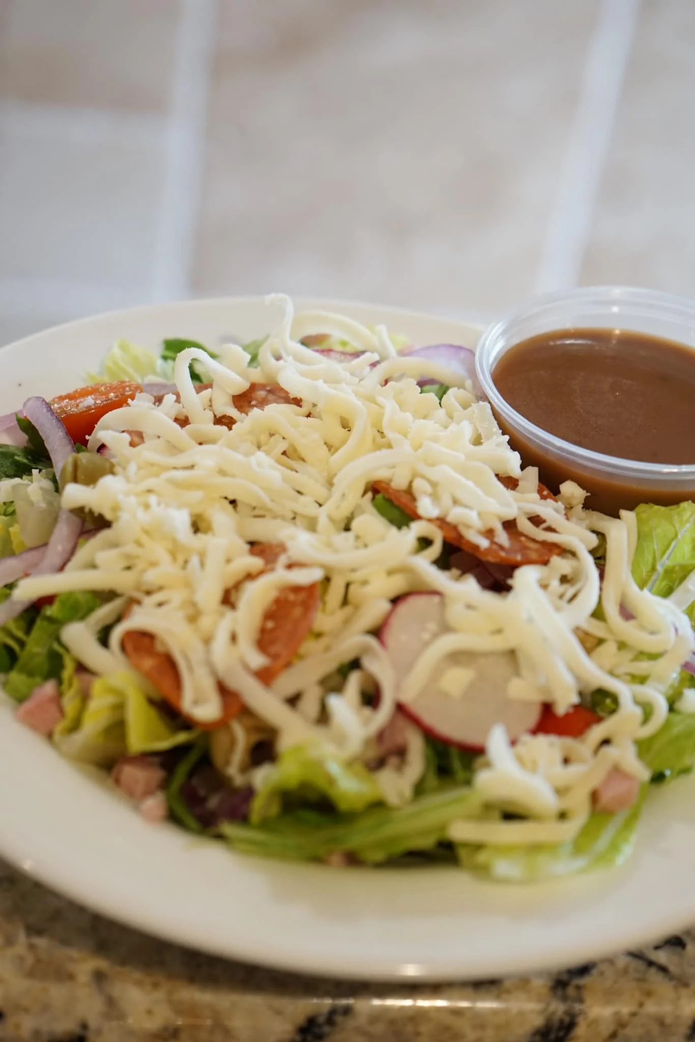 Fresh Mexican salad with cheese and dressing