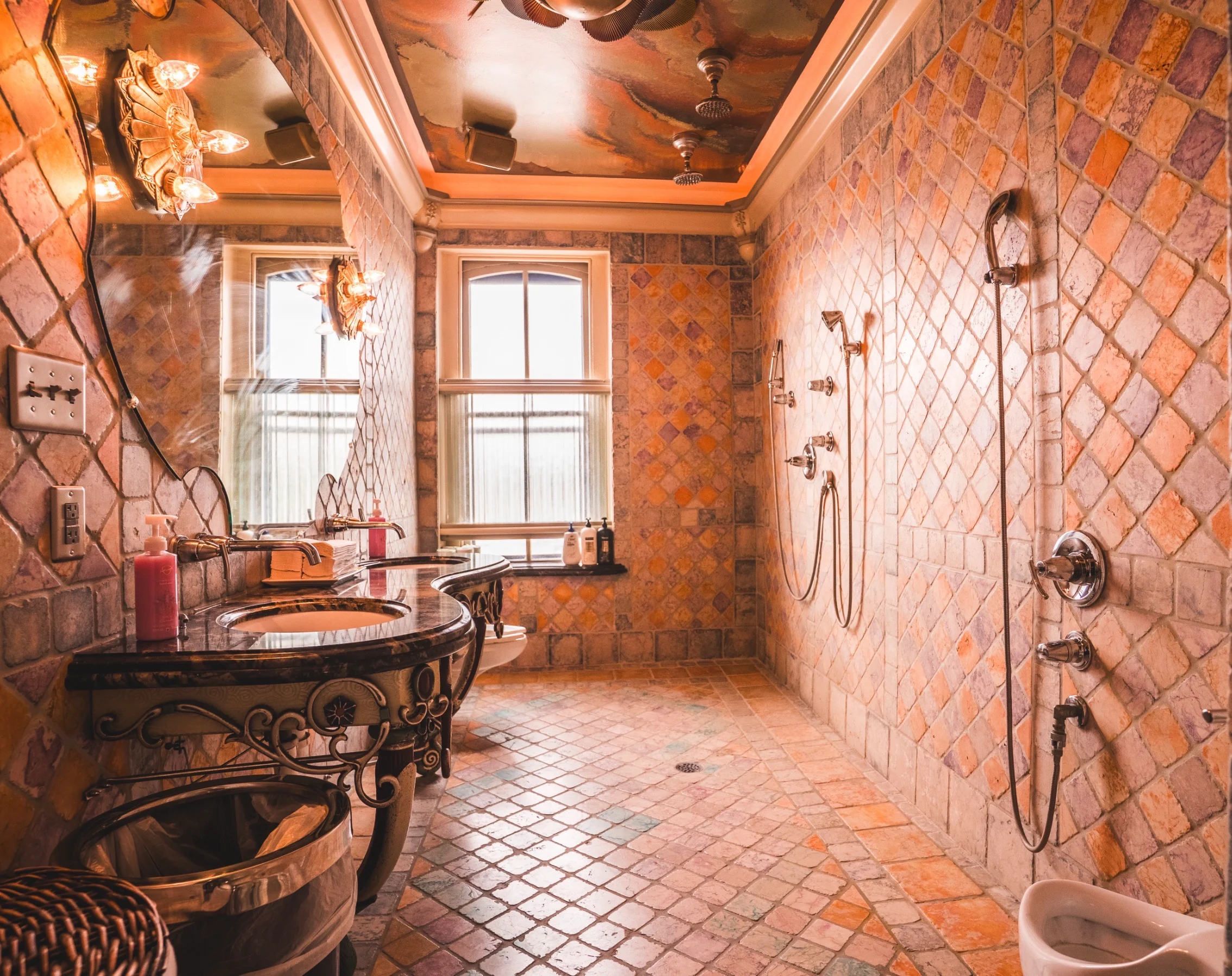 Elegant bathroom with tiled walls, vintage fixtures, and natural light.