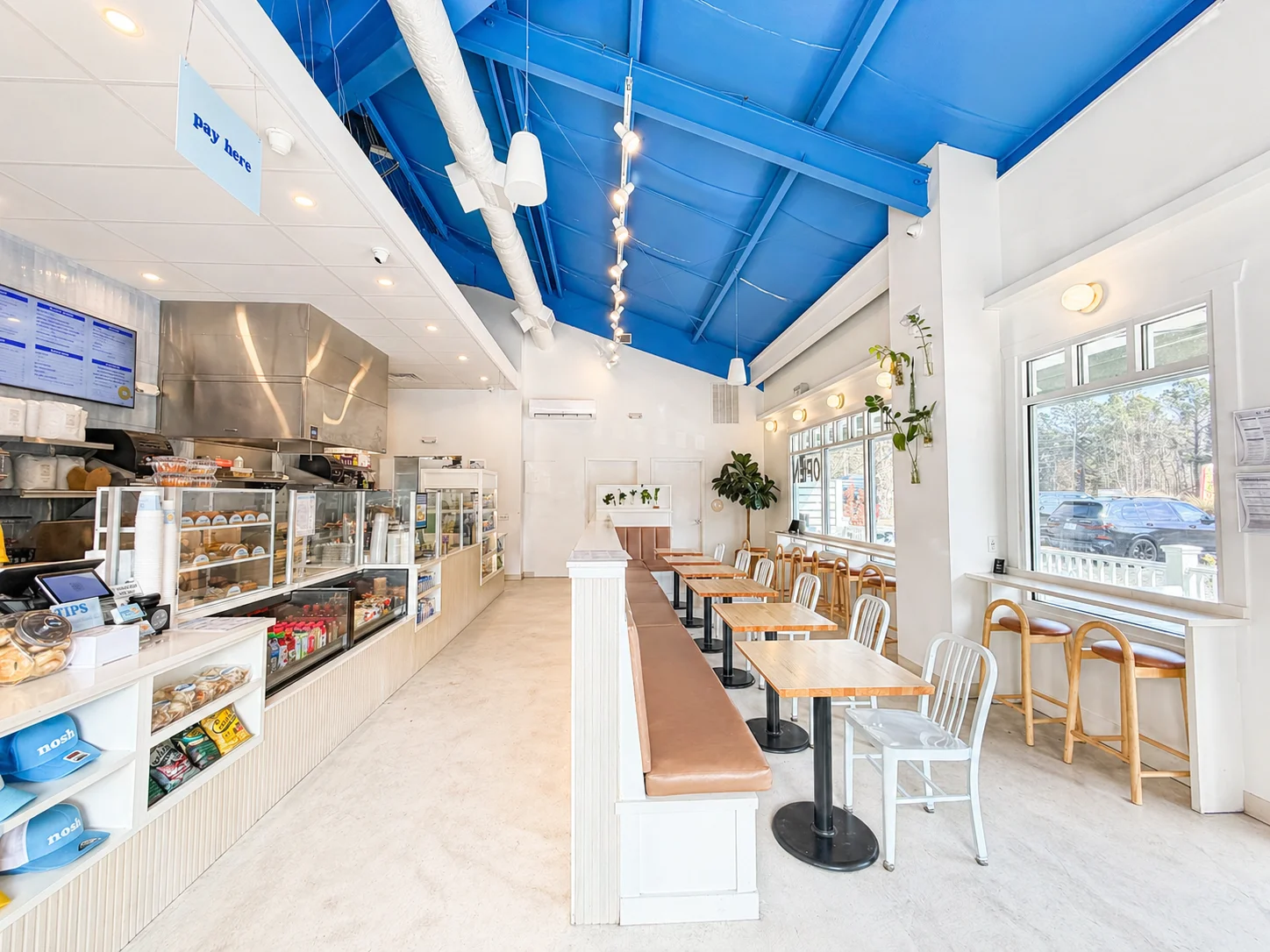 Interior of nosh NY bagels shop in Ridgeland with fresh bagel display counter and modern cafe setup