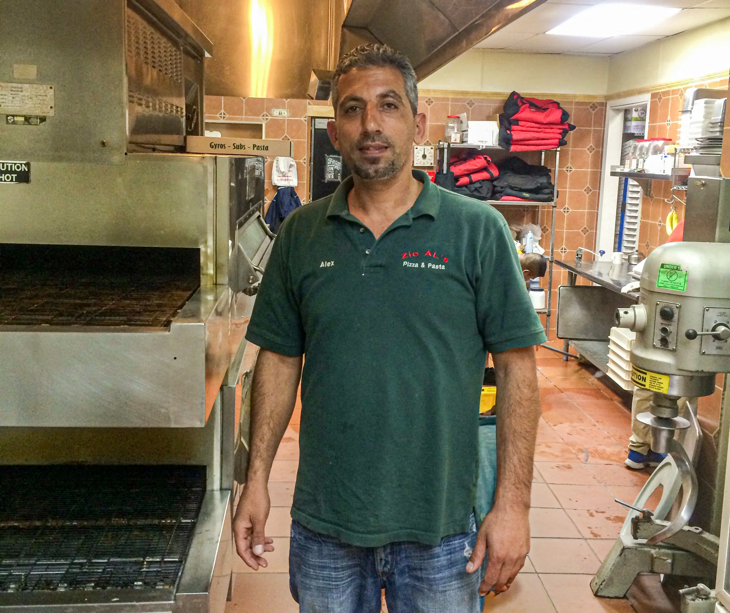Chef in a bustling restaurant kitchen