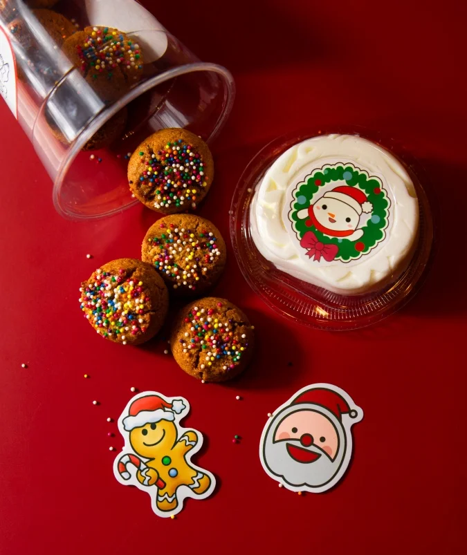 Festive holiday cookies and cake with cheerful decorations